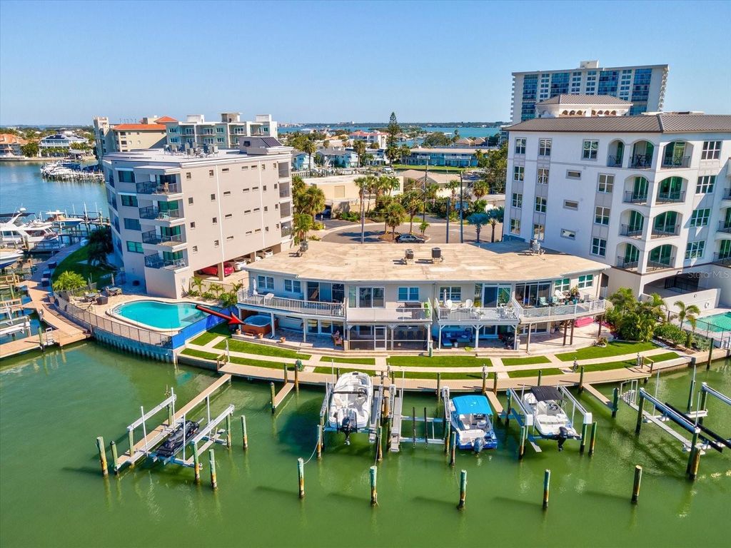 Photo of 205 Dolphin Point #4, Clearwater Beach, FL 33767 (MLS # TB8446838)