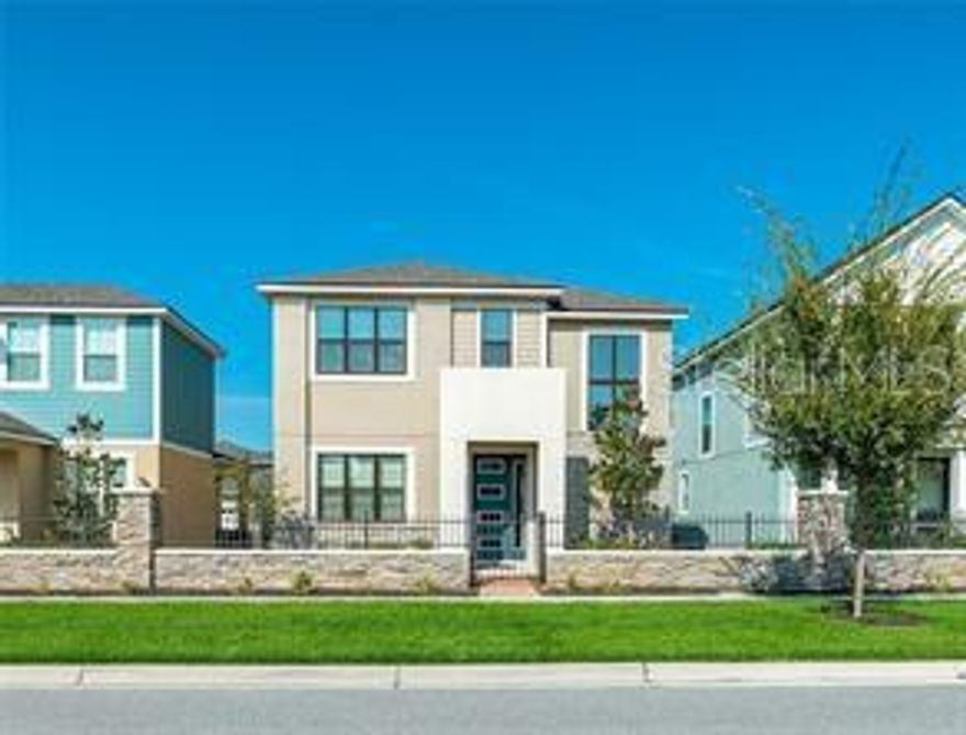 Immaculate property in excellent location ! Situated in desirable gated and man guarded community, right in the heart of Kissimmee, near the Loop Mall, schools and a short drive to shopping centers and attractions. This contemporary model from 2018 , features 2,120 sf of comfort and beautiful spaces. The first floor open plan includes the living room, dining room and kitchen, with a bonus room that can be a den or studio , and a half bath. The kitchen has 42 inch cabinets with quartz countertops and backsplash and beautiful stainless steel appliances . All bedrooms are located on the second floor, as well as a spacious loft with open view to the front side of the house, and a convenient laundry room next to the bedrooms. The master bathroom has a garden tub, separate shower and a double sink vanity with quartz countertops. Relax in the privacy of a rear porch and two car garage with rear entry.