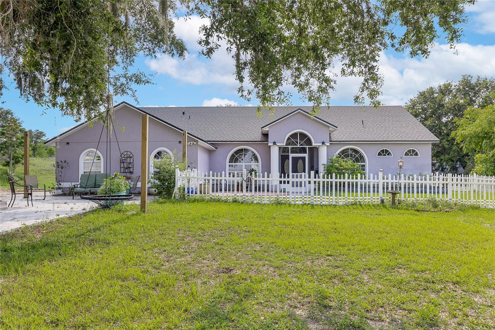 Want space between your neighbors? Want a long-range view? There is no HOA and you are zoned for horses. Would yo ulike this all this close to town? Look no further than this 3 bedroom, 2 bath pool home in Groveland, just minutes from Clermont's downtown shopping and resturants. This home sits on almost 5 acres of cross-fenced property on the top of Cherry Hill. You can see miles of panoramic long-range views! For the horses, you have a two-stall barn and a run-in shelterl, multiple fenced pastures, and tan arena has been started. Fenced-in area for chickens and goats with structures. The house has a fenced-in front dog run area, 2 patios, a screened in back porch and pool, and a two-car garage. Inside you will find a large great room open floor plan. The kitchen also has an eat-in space and opens to the family and dining room. A front office with double doors is just off the family room. Large master bedroom with walk-in closet and separate shower and tub. Brand new roof installed Jan 2025. This has been a working farm with horses, goats, chickens, ducks, etc. Located near Cherry Hill nursery. Just a few minutes drive to downtown Groveland and Clermont. Peaceful street with all large tracks of land make this your new home today.
