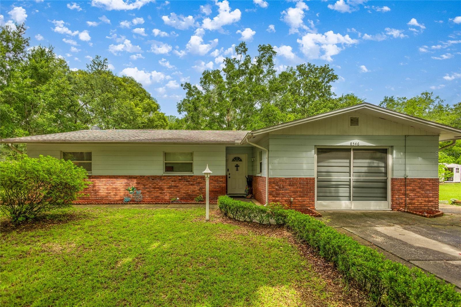 This charming 3-bedroom, 2-bathroom single-family home sits on nearly an acre, offering the space, privacy, and freedom you’ve been looking for and all without the burden of an HOA or deed restrictions. Bring your boat, RV, or toys and enjoy life on your terms!
Step inside to find a comfortable and well-maintained interior with many major updates already taken care of for you. The HVAC system was updated in 2017, and recent improvements include a new drain field, well, and water heater—giving you peace of mind for years to come.
This home features a spacious and enclosed sunroom, perfect for enjoying your morning coffee, relaxing with a good book, or simply taking in the view of your expansive backyard, no matter the weather. Whether you’re entertaining guests or just enjoying a peaceful afternoon, this bright and airy space is sure to become a favorite retreat.
Inside the main living areas flow seamlessly, and the kitchen is ready for your personal touches. Each of the three bedrooms offers flexibility and space for family, guests, or a home office.
Outside, you’ll find a large backyard that’s partially fenced, ideal for pets or play, and a storage shed that provides additional room for tools, toys, or gardening gear. The one-car garage adds both convenience and functionality to your day-to-day routine.
If you’re looking for space to stretch out without any HOA headaches this is the one.