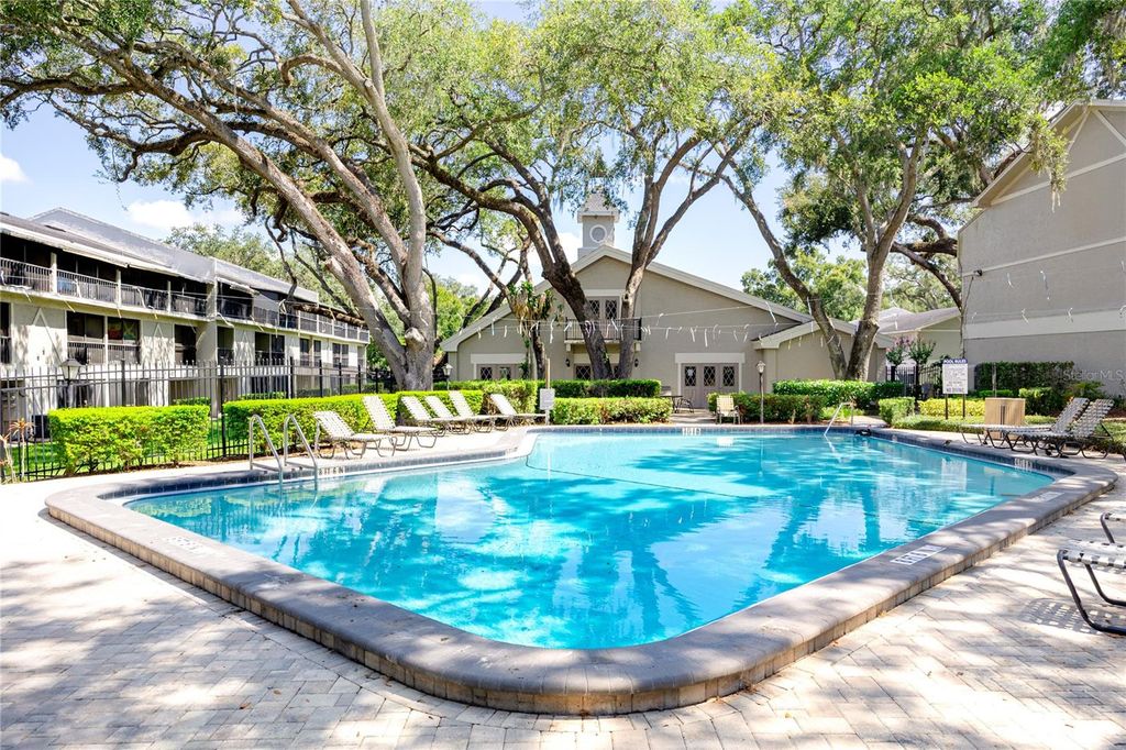 Photo of 14424 Reuter Strasse Circle #104, Tampa, FL 33613 (MLS # TB8525526)