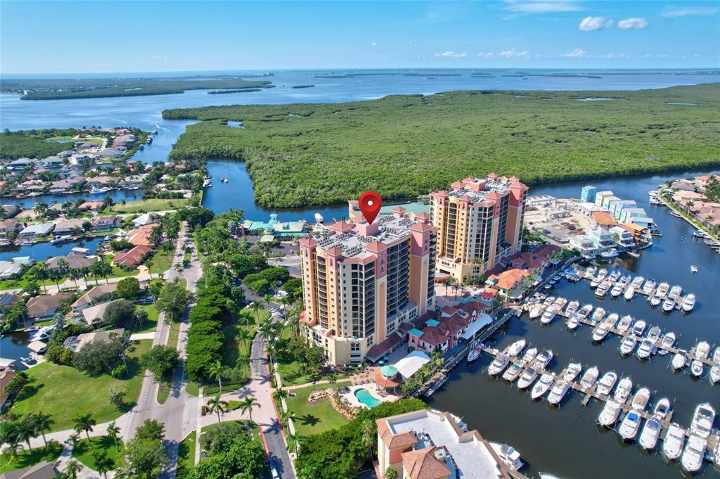 **Recent Price Improvement ~ Being Sold Fully Furnished**
Welcome home to resort style living in the highly sought after Water Front Yachting Community of Cape Harbour! Picture waking up with a cup of coffee and relaxing on your private 12th floor patio, overlooking the marina while watching the yachts float out to the Gulf of Mexico; or better yet, how about sipping on a late afternoon cocktail with front row seats to the most amazing sunsets imaginable!
As soon as you enter your new home you'll be impressed with the upgrades and attention to detail found throughout; not to mention the extra space, as this corner / end unit is the largest floor plan available! The open concept is wonderful for entertaining, while the split floor plan is great for privacy and a little peace and quiet. Inside you'll find 3 bedrooms, 2 baths, a separate laundry, bonus office / den, living, dining, and with a massive kitchen at the center of it all. Notable upgrades include a complete new AC system, new water tank, impact windows and doors, granite counters, walk in closet, add-on kitchen closet cabinet / pantry, 18 inch tile on the diagonal, custom window treatments, floor to ceiling tiled and glass shower.
If the inside of the home has you excited, wait until you hear about the community! Cape Harbour is amazing and offers their residents a lifestyle hard to find anywhere on the coast. As part of your home ownership you'll have unlimited access to the community clubhouse, multiple pools, a fitness center, tennis courts, basketball court, pickleball court, and a full service marina with wet and dry slips! The Harbour is also well known for their multiple waterfront restaurants, fishing charters, boat rentals, shops, live music, and numerous festivals throughout the year! Residents and boaters alike travel from miles away, to enjoy what the residents of Cape Harbour get to live everyday...now's your opportunity to be a part of the excitement!