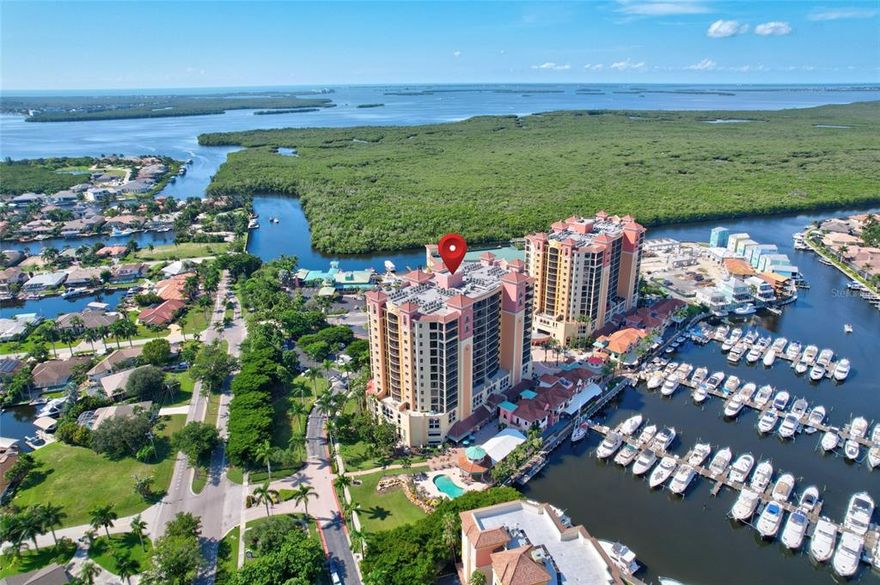**Recent Price Improvement ~ Being Sold Fully Furnished**

Welcome home to resort style living in the highly sought after Water Front Yachting Community of Cape Harbour!  Picture waking up with a cup of coffee and relaxing on your private 12th floor patio, overlooking the marina while watching the yachts float out to the Gulf of Mexico; or better yet, how about sipping on a late afternoon cocktail with front row seats to the most amazing sunsets imaginable!  

As soon as you enter your new home you'll be impressed with the upgrades and attention to detail found throughout; not to mention the extra space, as this corner / end unit is the largest floor plan available!  The open concept is wonderful for entertaining, while the split floor plan is great for privacy and a little peace and quiet.  Inside you'll find 3 bedrooms, 2 baths, a separate laundry, bonus office / den, living, dining, and with a massive kitchen at the center of it all.  Notable upgrades include a complete new AC system, new water tank, impact windows and doors, granite counters, walk in closet, add-on kitchen closet cabinet / pantry, 18 inch tile on the diagonal, custom window treatments, floor to ceiling tiled and glass shower.

If the inside of the home has you excited, wait until you hear about the community!  Cape Harbour is amazing and offers their residents a lifestyle hard to find anywhere on the coast.  As part of your home ownership you'll have unlimited access to the community clubhouse, multiple pools, a fitness center, tennis courts, basketball court, pickleball court, and a full service marina with wet and dry slips!  The Harbour is also well known for their multiple waterfront restaurants, fishing charters, boat rentals, shops, live music, and numerous festivals throughout the year!  Residents and boaters alike travel from miles away, to enjoy what the residents of Cape Harbour get to live everyday...now's your opportunity to be a part of the excitement!