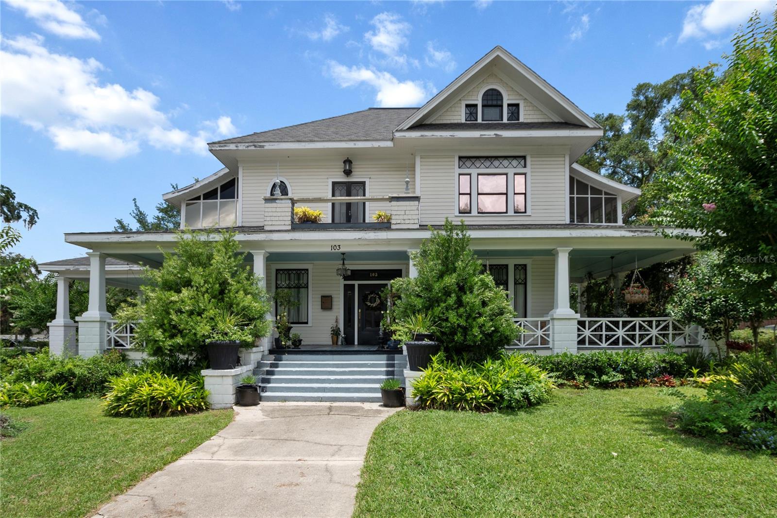 If you have ever envisioned this type of lifestyle, envision it grandly in this 1910, "Residential Business Historical" RBH3, GEM! Situated just off Highway 40 this stunning property is located on a corner lot and just minutes from Ocala Square. Offering a total of six bedrooms and five full baths, each exuding charm and transporting all to a bygone era, this home is a dream. Relish the character of the wrap-around porch, overlooking Crepe Myrtle and a spacious yard adorned with lovely landscaping. Upon entering, admire the exquisite oak in the open living and dining areas. The dining room features stunning coffered ceilings providing warmth and sophistication. Adjacent to this space, Tiger Oak pocket doors open to a tranquil sitting area, with another set leading into the den, which could also serve as a first-floor primary bedroom due its attached full bathroom. The well-appointed kitchen features a Viking range, beautiful prep space, along with a whimsical sitting area for dining allowing wonderful outdoor views, and a second staircase for added convenience. The exquisite woodwork continues upstairs, where you will be transported back in time while enjoying the elegant sitting area, perfect for reading or perhaps creating art. There are endless possibilities! The upstairs features three generously sized bedrooms, each full of character. One bedroom includes an ensuite, along with one of two glassed and screened-in sleeping porches, providing an ideal space for relaxation after a long day. Take advantage of the spacious attic, perfect for ample storage or an amazing renovation project. Multi-generational homes are becoming increasingly popular, and this property exceeds expectations. Considering a business opportunity? Let your creativity shine, as this charming property has hosted a variety of business styles over time. Located approximately two blocks from the square, the market can be enjoyed on Saturdays, with nearby attractions including the City Center, Silver Springs State Park, the Reilly Arts Center, and the Apple Museum of Art. For Equestrian enthusiasts, the Ocala World Equestrian Center is the largest in the United States, offering world-class indoor and outdoor facilities. Seize the chance to make this exceptional property your own, call today for your private showing!