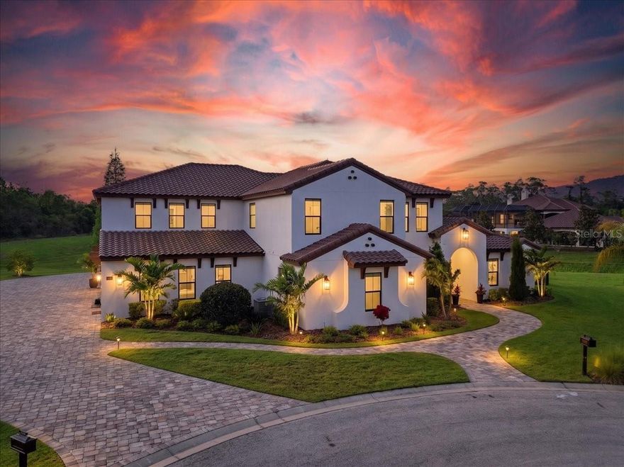 Welcome to a truly one-of-a-kind luxury estate in the prestigious gated community of Grasslands Golf & Country Club, where exceptional design and elevated living come together at the highest level. Built by Hulbert Homes, this remarkable residence offers 5 bedrooms, 4.5 bathrooms, and an extraordinary blend of sophistication, innovation, and entertainment.
Designed for both grand-scale hosting and everyday enjoyment, the home features a fully climate-controlled, indoor pickleball court with a professional regulation layout and integrated sound system. A second-floor observation deck overlooks the court, creating a one-of-a-kind entertainment experience.
Set on an oversized, ultra-private lot backing to a peaceful preserve, the property makes an immediate impression with an extended paver driveway and grand 10-foot solid mahogany entry doors. Inside, soaring 22-foot ceilings, custom wood beams, and elegant Hinkley fixtures define the open-concept living spaces, creating a dramatic yet inviting atmosphere ideal for entertaining.
At the center of the home, the chef’s kitchen is both stunning and functional, featuring exquisite Dolomite countertops, striking brass fixtures, premium cabinetry, a double refrigerator, top-of-the-line Bosch appliances, an induction cooktop, and a spacious walk-in pantry.
The first-floor primary suite is a private retreat, complete with a fully illuminated tray ceiling, a sitting area, and double doors opening directly to the pool. The spa-inspired primary bath offers a soaking tub, custom walk-in shower, and elegant Dolomite finishes for a true resort-style experience.
Outdoor living is equally impressive, with a fully screened backyard oasis that includes a heated saltwater pool and spa, expansive entertaining space, outdoor kitchen, and gas fireplace—perfect for year-round enjoyment.
Upstairs, you’ll find three additional bedrooms and a spacious loft overlooking the main living area, enhancing the home’s open and connected design. Built with solid block construction, a tile roof, and exceptional finishes throughout, this meticulously crafted home leaves no detail overlooked.
Residents of Grasslands enjoy access to an 18-hole championship golf course, resort-style pool, clubhouse dining, fitness center, illuminated pickleball courts, and 24-hour guard-gated security, all just minutes from premier shopping, dining, and medical facilities.
This is more than a home—it is a statement of lifestyle, and truly unlike anything else available in Central Florida.