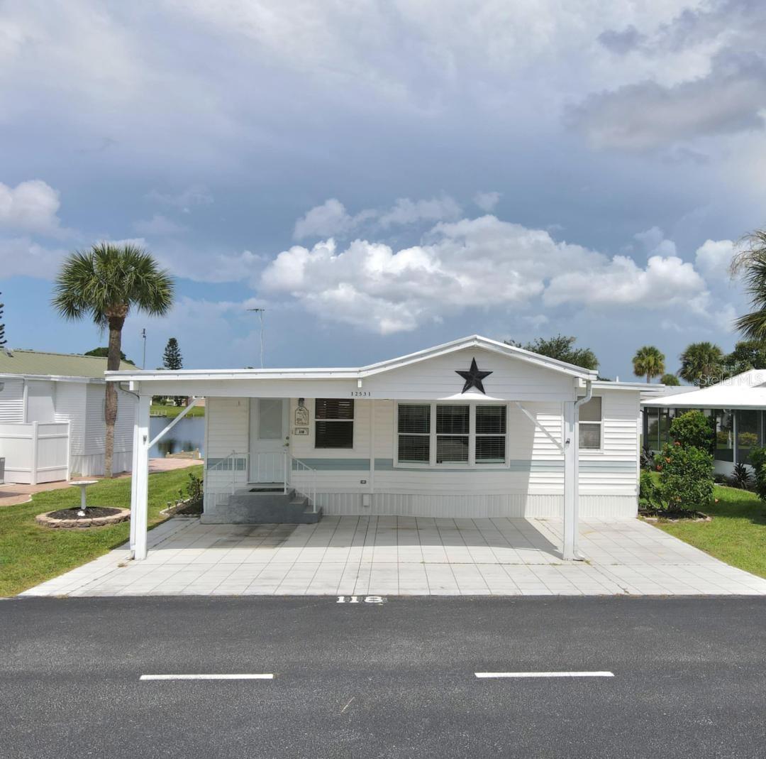 Highly motivated owner. Bring all offers. This 2 bedroom waterfront home has a dock off the screened porch. This home has been lovingly maintained and is being sold mostly furnished. Blue Cypress is an active retirement community, 55 +. There are lots of activities in this community. There is a 9 hole golf course, fishing, beautiful pool and clubhouse and new pickleball court. The community boat ramp takes you to Lake Okeechobee. Many activities include bingo, card games, etc. Homeowners fee of $240/mo. pays for water, sewer, trash, recycling. All measurements are approximate, please measure for exact.
