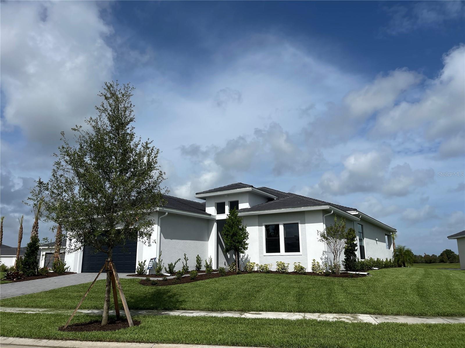 Annual Rental – Brand New Van Gogh Model with Long Water View | Artistry Sarasota
Stunning new 3BR+Den/3BA home on oversized corner lot in gated Artistry Sarasota. Built by Kolter Homes, this 3,000+ SF residence offers an open floor plan with 11–14 ft ceilings and expansive sliding glass doors framing one of the best water views in the community.
Gourmet kitchen features luxury cabinetry, an oversized island, a gas range, a casual dining nook, and a formal dining space. The spacious primary suite features dual vanities, double showerheads, and a large walk-in closet. The second bedroom features an en-suite bath and a walk-in closet, while the third bedroom and den with flexible living options. Extended covered lanai with two ceiling fans, hurricane shutters, and X flood zone.
Artistry Sarasota is a new home community in Sarasota, FL, that features Kolter Homes’ award-winning floor plans and amenities. This gated community is situated away from the congestion in the growing Sarasota East area, offering residents easy access to the region's best shopping, dining, beaches, recreation, and entertainment. Many top-ranked golf courses, including The Founders Club and Laurel Oak Country Club, are located in the immediate vicinity. The Sarasota Theatre & Arts District is 10 miles away, and Sarasota-Bradenton International Airport is a 14.5-mile drive.
Artistry amenities: heated saltwater lap pool, fitness center, pickleball, basketball, playground, and scenic trails.
Schedule a private showing today!