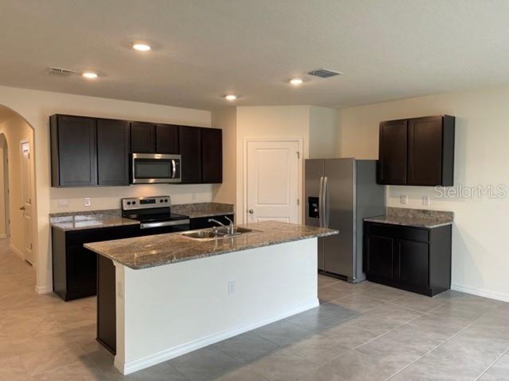 Photo of 5715 Margate Mill Bend, Wesley Chapel, FL 33545 (MLS # TB8492865)