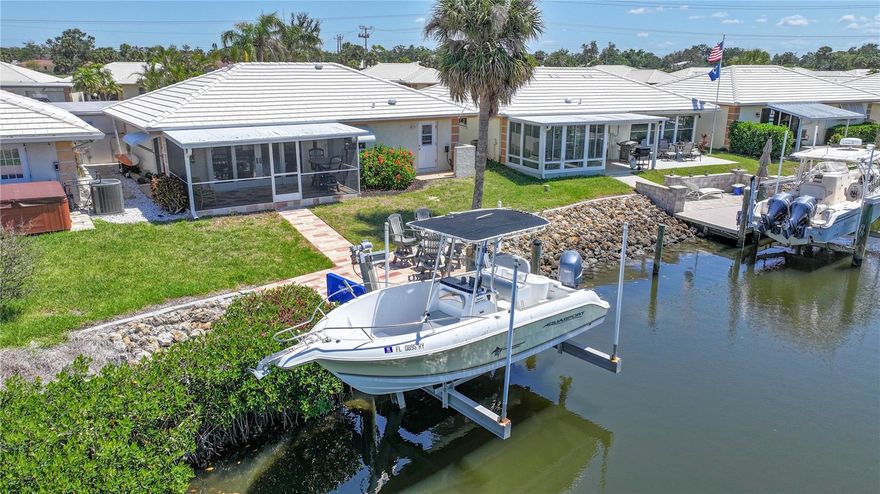 Waterfront with your own private dock with 10,000lb elevator lift. This home is being offered fully furnished from the inside out to the lanai and boat dock. The kitchen features raised wood cabinets and a large 10ft long breakfast bar. The kitchen has views of the canal and opens up to the dining room and living room. As you walk into the nicely appointed open floor plan, you immediately feel relaxed while enjoying the water views and fish jumping. There is nothing to do but move in and enjoy your new home. Taking the boat out is a breeze. Just lower it into the water and you are a short ride out to the intracoastal, the Venice Jetties and Midnight Pass. There are many great waterfront restaurants you can access by boat. If you happen to catch some fish while you are out enjoying the boat, there is a fish cleaning station on the dock. Located between Sarasota and Venice with easy access to I-75. Close to shopping, beaches, restaurants, Oscar Scherer Park and so much more.