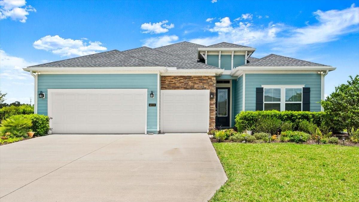 Welcome to 4111 Clifden Drive Ormond Beach, Florida 32174. This move in ready home is over 2500 square feet. This three-year old home, built by Lennar, in well-maintained in Wexford Reserve Community. This is the largest model offered by Lennar with 4 large bedrooms and three baths; including the Master with a huge walk-in closet. Every bedroom has access to its own bathroom, making this a great home for a large family or a multi-generational family situation. The kitchen is very large with quartz countertops, two places for stools for an eat-in situation and it includes a huge area for the family for breakfast or casual dining; within the kitchen. This home includes large closets in all bedrooms and two large linen closets; one dedicated to the Master Bedroom. It is a split plan with the Master at the back of the house and all guest areas on the other side. All appliances convey; including washer, dryer in the laundry room off the kitchen; refrigerator, microwave and oven. The colors are grey and beige with the entire living area being tiled with wood-like grey tile and the bedrooms freshly carpeted. There is a separate dining room off the foyer and an open concept with the family room leading out to the screen porch area. The house is fully fenced and has the addition of a large paver patio overlooking an area which cannot be developed. Complete privacy is offered as no one is able to build in the back. The landscaping offers mature bushes for privacy, a flower garden and stone area in the back, flower garden in the front and mature fruit trees. Extras include a well; that is used for the watering of your yard; and saving money on the monthly bill. There is an automated sprinkler system, three-car garage, like-new appliances and garage door automated mechanism for easy access. The house is wired as a “smart home” with the access box access in the laundry room.
This almost new, and move-in ready hone is priced to sell and won’t last long. It is in an HOA and he month HOA cost is approximately $100 dollars a month and is extremely reasonable. The neighborhood is walk or bike-ride friendly with sidewalks down every street. Schedule your exclusive showing today!
