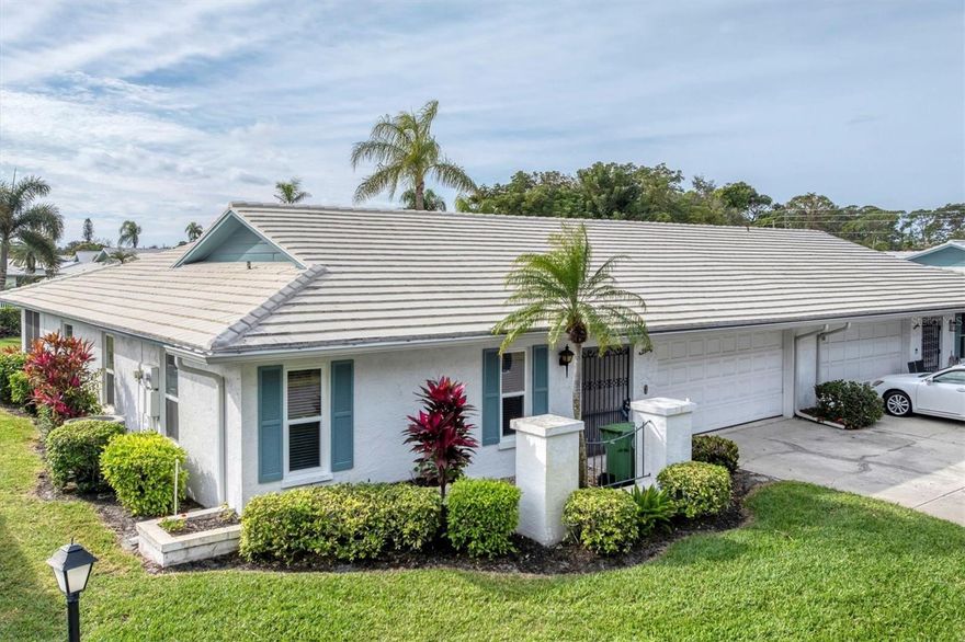 Welcome to Village Green, a highly desirable, maintenance-free 55+ community in West Bradenton! You will notice **“Mr. Clean lived here!”**

This well-maintained 2-bedroom, 2-bath condo with a 2-car garage is ideally located just steps from the community pool, offering the ultimate in convenience and relaxed Florida living. Walk through the steel gate into your private foyer. This spacious, light-filled open floor plan features tile floors with carpet in the bedrooms, and comfortable living and dining areas—perfect for entertaining or everyday enjoyment.

The kitchen offers new appliances, ample cabinetry, a pantry, and generous workspace. The primary suite includes **his-and-hers closets** and an en-suite bath. The **lanai** features double sliding glass doors, great for entertaining or just relaxing.

This condo has an inside utility room with a washer, dryer, and laundry tub, and a large enough area to accommodate an office. Located on a dead-end street, enjoy the peaceful setting with sidewalks and beautifully landscaped grounds that Village Green is known for. Residents appreciate the active yet laid-back lifestyle, with amenities including a heated pool and walking paths.

Conveniently located near shopping, dining, medical facilities, Blake Hospital, downtown Bradenton, and just a short drive to the area’s renowned Gulf beaches. **Located outside of a flood zone due to one of the highest elevations.**

Whether you’re looking for a full-time residence or a seasonal retreat, this condo offers one of West Bradenton’s most sought-after 55+ communities.