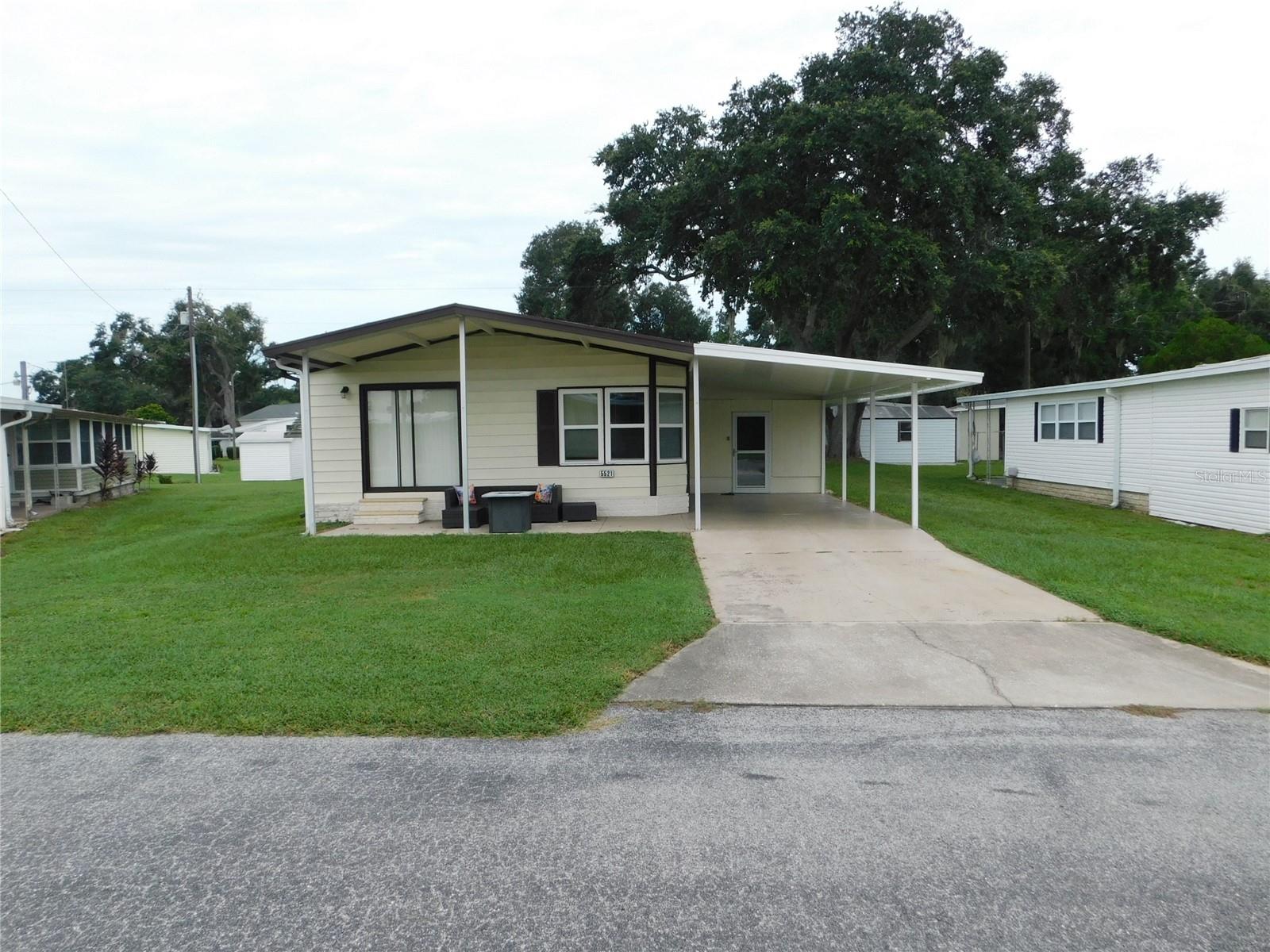 Charming 2-Bedroom Year-round Rental in Betmar Acres – 55+ Community. Welcome to your new home in Betmar Acres, one of Zephyrhills’ most sought-after 55+ communities. This well-maintained 2-bedroom, 2-bath manufactured home offers comfort, convenience, and an active lifestyle. Inside, you’ll find a bright open floor plan with a spacious living room, fully equipped kitchen, and a cozy dining area. Both bedrooms are generously sized, and the primary suite includes a private bath. A Florida room gives you extra space to relax and enjoy the Florida sunshine. Step outside and enjoy a large carport, storage shed, and low-maintenance yard. Living in Betmar means access to three clubhouses, swimming pools, 27 holes of golf, pickleball, shuffleboard, and a wide range of social clubs and activities. Shopping, dining, and medical facilities are just minutes away. This rental is perfect for someone who wants to enjoy the Florida lifestyle, with resort-style amenities, without the hassle of upkeep.