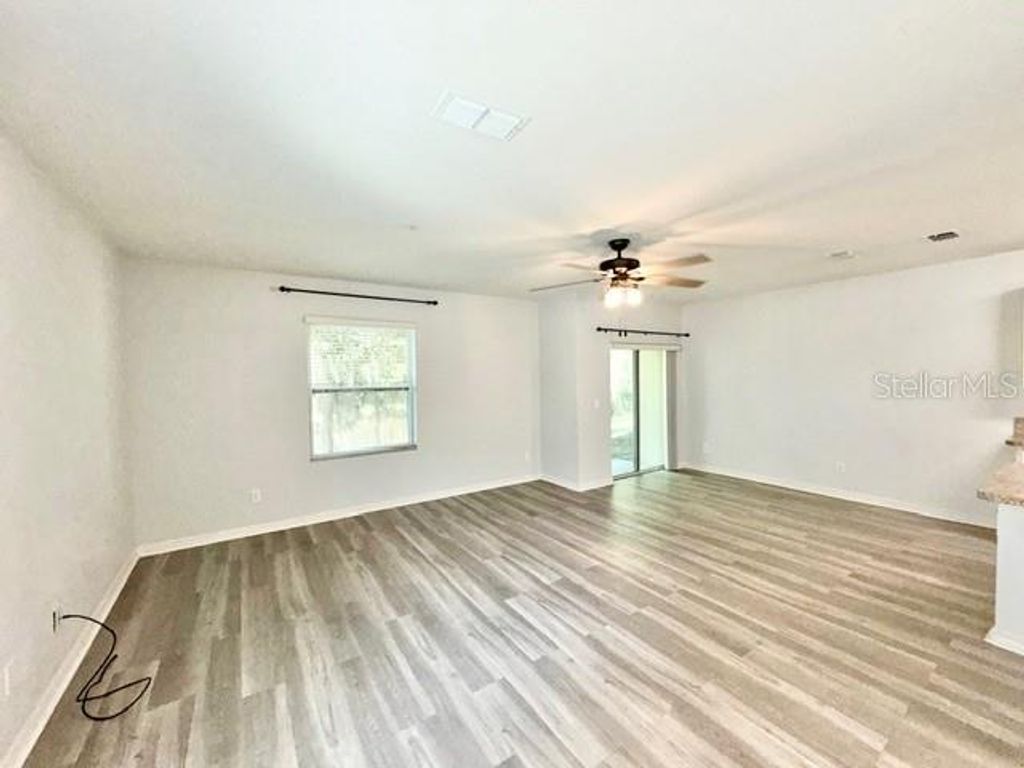 Photo of 3569 Seneca Club Loop #C, Orlando, FL 32808 (MLS # O6401280)