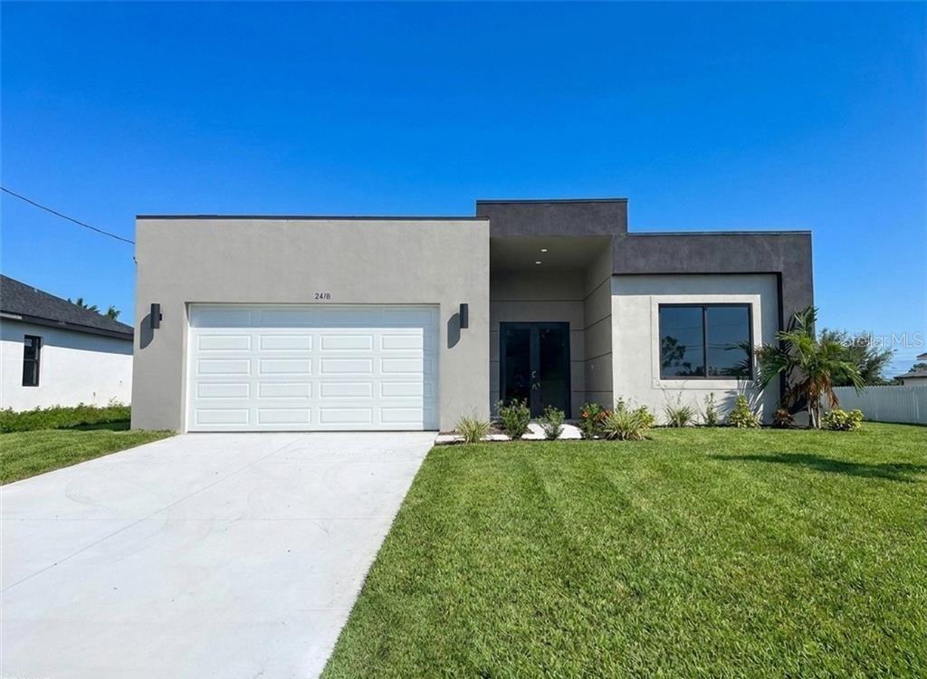 Photo of 2418 NW 25th Street, Cape Coral, FL 33993 (MLS # O6440557)