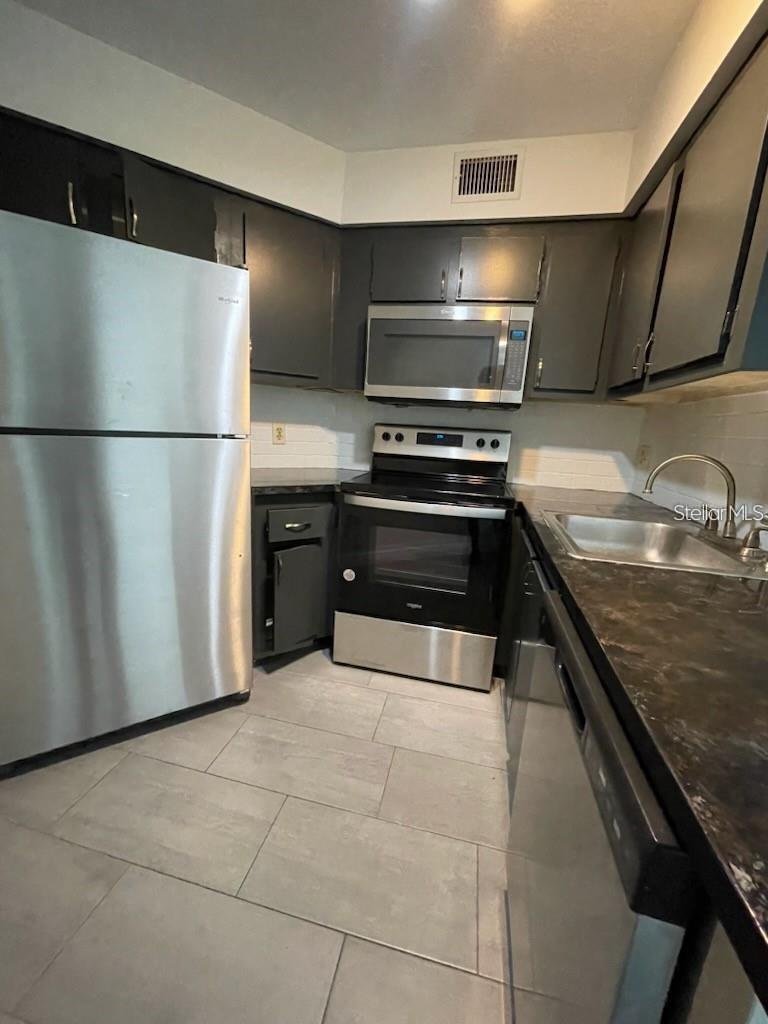 Photo of 3927 Atrium Drive #U3, Orlando, FL 32822 (MLS # R4912117)