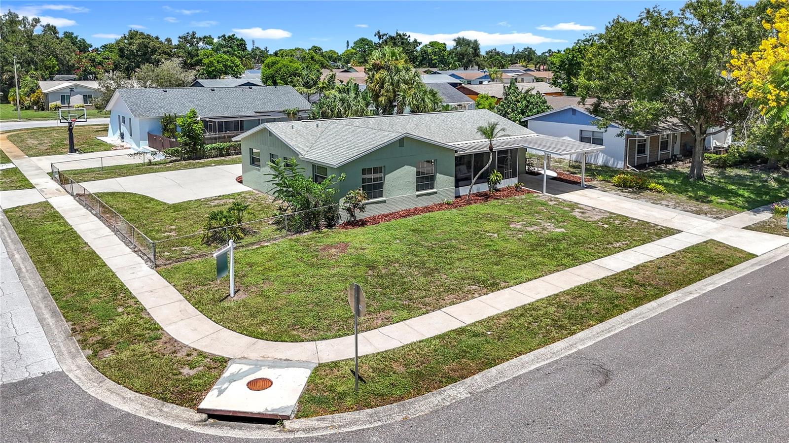 YOUR BRADENTON OASIS AWAITS!
Escape to your own slice of paradise in this beautifully remodeled Bradenton home blending tropical serenity with urban convenience on this large corner lot! This stunning 3-bedroom, 2-bath residence, with a fully converted garage provides an incredible bonus space that can serve as a fourth bedroom, a home office, or a fun game room---the choice is yours! This offers the perfect blend of modern style and flexible living situated on an attractively maintained lot with curb appeal. Step inside to a bright, modern interior featuring a remodeled kitchen with Frigidaire appliances, sleek ceramic tile flooring, and two fully remodeled bathrooms. Enjoy the quintessential Florida lifestyle with screened-in front and back porches, a covered carport, and a fenced-in yard, all designed for comfort and convenience. THIS HOME HAS NO HOA FEES and RENTAL RESTRICTIONS, and is in a NO FLOOD ZONE, offering you the freedom to use as a primary residence, a long-term rental, or a high-performing short-term vacation rental. This home's prime location between Manatee Avenue and Cortez Road offers quick access to area schools, the stunning beaches of Anna Maria Island, Siesta Key, IMG Academy, downtown Bradenton, and vibrant Sarasota. You'll be just 10 minutes from Robinson Preserve, a nature lover's dream with walking trails and kayaking. Whether you're looking for a forever home or a smart investment property, this Bradenton gem checks every box.
