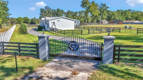 Photo of 521 NW 80th Avenue, Ocala, FL 34480 (MLS # OM714237)