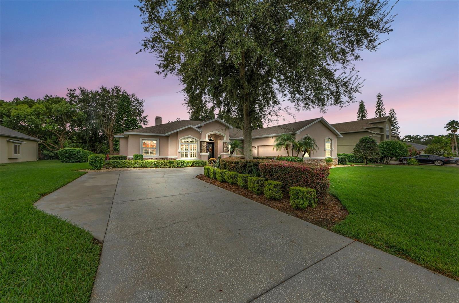 Welcome Home - Move in ready!! This freshly painted 3-bedroom, Plus Office/Study, 3-bathroom pool home is nestled in the exclusive gated community of Riverside Estates, located in the highly sought-after Mitchell High School district. Set on a quiet cul-de-sac with timeless stone accents and a side-entry 3-car garage, this nearly 2,800 sq. ft. residence on .92 acres pond/conservation view homesite offers elegance, comfort, and thoughtful upgrades throughout. Step inside through double front doors to soaring tray ceilings, abundant natural light, and sweeping views of the pool and tranquil pond beyond. The open, split floor plan is ideal for both everyday living and entertaining. The spacious living room features a sliding glass pocket door for seamless indoor-outdoor living, surround sound speakers, and elegant in-floor outlets. Host gatherings in the formal dining room or enjoy casual meals in the gourmet kitchen complete with granite countertops, stainless steel appliances, a prep island, pantry, double breakfast bars, and a seamless glass nook window framing the outdoor views. Plantation shutters and crown molding throughout add an elevated touch. The private primary suite offers direct pool access, a custom walk-in closet, and a spa-inspired ensuite with dual vanities, soaking tub, and double shower. Across the home, French doors open to a private office with built-ins, while two additional bedrooms include a guest suite with a private bath that also serves as a pool bath.
Outdoor living is second to none, with an oversized screened lanai featuring a natural gas-heated pool and spa, sealed paver deck, and a full outdoor kitchen with grill and beverage fridge. The expansive fenced yard preserves pond views while ensuring privacy and no rear neighbors.
This home is move-in ready with extensive updates: new roof (2019), new water heater (2019), AC system (2017), pool enclosure screens (last 2 years), new pool pump and pipes (2021), new pool gas water heater (2023), new water softener (2024), new lawn well pump (2024), Water Guru automatic pool chemical reader, Ranchio smart sprinkler control, and natural gas fireplace, furnace, grill, and spa heater. A well-fed irrigation system provides cost-efficient landscaping.
Luxury and practicality blend perfectly in this rare Riverside Estates find, offering resort-style living, energy-efficient features, and a prime location near top schools, shopping, dining, and more. Schedule your showing today!