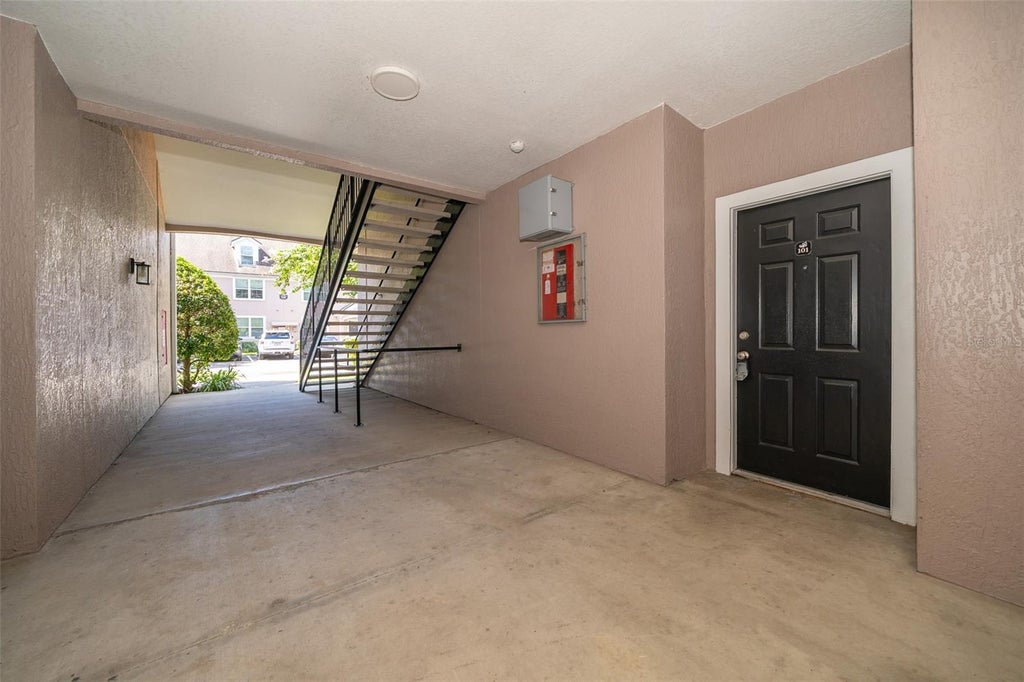 Photo of 6663 Queens Borough Avenue #101, Orlando, FL 32835 (MLS # O6418057)