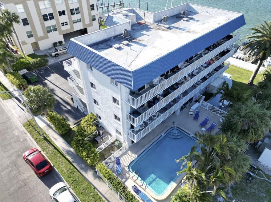 Dreaming of the perfect beach getaway in Clearwater Beach? This is your opportunity to own a slice of paradise—whether for personal use or as a high-performing investment property. Rarely available, this TOP floor unit offers flexible 1–7 day rental potential just off the main beach strip, combining income opportunity with privacy and convenience. No climbing up stairs, the building has a elevator. Enjoy amenities that are hard to find in this area, including free parking, a poolside grilling area, and a more relaxed, tucked-away setting. This well-appointed one-bedroom unit comfortably sleeps up to four guests, featuring a pull-out sofa in the living area. Step out onto your private balcony and take in peaceful views of the Intracoastal Waterway, where boats drift by in a serene coastal setting. Recent 2025 updates include new flooring throughout, a new water heater, a brand-new A/C unit, and updated furnishings—making this property truly move-in or rental ready. The kitchen is fully equipped with a cooktop, refrigerator, microwave, and all essential appliances and dishware—just bring your suitcase! Located just two blocks from the beach, you’ll be within a short distance to an array of shops, restaurants, and entertainment. Clearwater Beach is consistently ranked among the top beaches in the country, known for its sugar-white sand and vibrant coastal lifestyle. Whether you're looking for your own beach retreat or a turnkey investment, this property checks all the boxes.