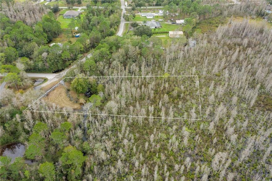 In the Heart of  Wesley Chapel! Located in the popular, deed-restricted community of Quail Hollow, this 2 ACRE LOT.  The partially wooded lot has no neighbors on either side or to the rear, offering plenty of privacy. Tons of space to build a home just the way you want it, with room for a pool and the perfect back yard (minimum 1,200 sq ft to build). BRING YOUR LIVESTOCK - This property is zoned to allow goats and pigs, plus one horse per acre.  Centrally situated in between SR 52 & 54, it's also close to I-75 and other major roadways. There are tons of great amenities nearby, including schools, entertainment, and shopping, like The Grove at Wesley Chapel.  No HOA fees! Don't miss this opportunity to build in one Tampa Bay's most up-and-coming areas. See this lot today!  Wetlands Survey Available!