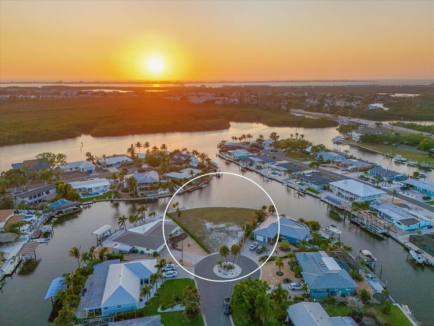 Come discover this slice of paradise and the rare builing opportunity on a vacant lot in Flamingo Cay! This property warrants and demands that a dream home be built on this premium lot with 158 feet of saltwater seawall. Western exposure is perfect for enjoying sunsets and afternoon tropical breezes. This extra-large tip lot provides for on-grade stem wall construction possibilities. Seller has architectural plans and renderings for a 4BD/4BA pool home designed specifically for this lot with 2,900 SF under AC and 3,500+ SF under roof. Seawall was constructed in 2022. This property is a perfectly situated boater's paradise boasting safe harbor, no humpback bridges and having your boat on plane in just a few minutes! Stroll, bike, kayak or paddleboard to the 600+ acre Robinson coastal preserve in just minutes as well. Just sit back and enjoy watching the dolphins or manatees play right along your seawall! Flamingo Cay is located just minutes by boat or car to waterfront dining and the gorgeous Gulf beaches of Anna Maria Island. HOA is voluntary. Don't miss out on this fantastic opportunity....and come see why those that live here LOVE to call Flamingo Cay home!