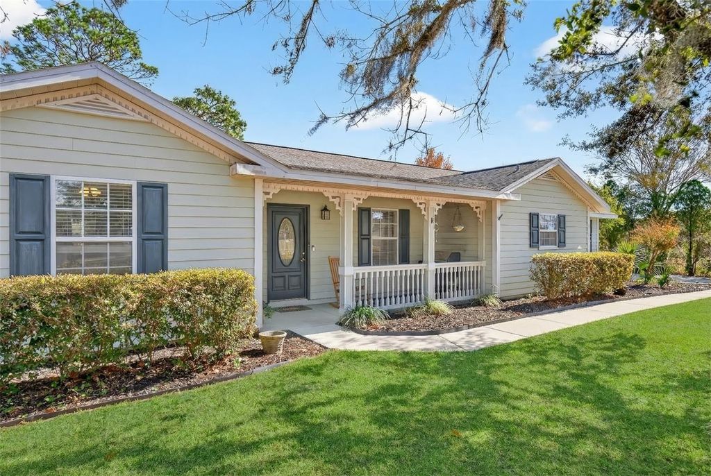 Photo of 5940 NE 57th Loop, Silver Springs, FL 34488 (MLS # O6374786)