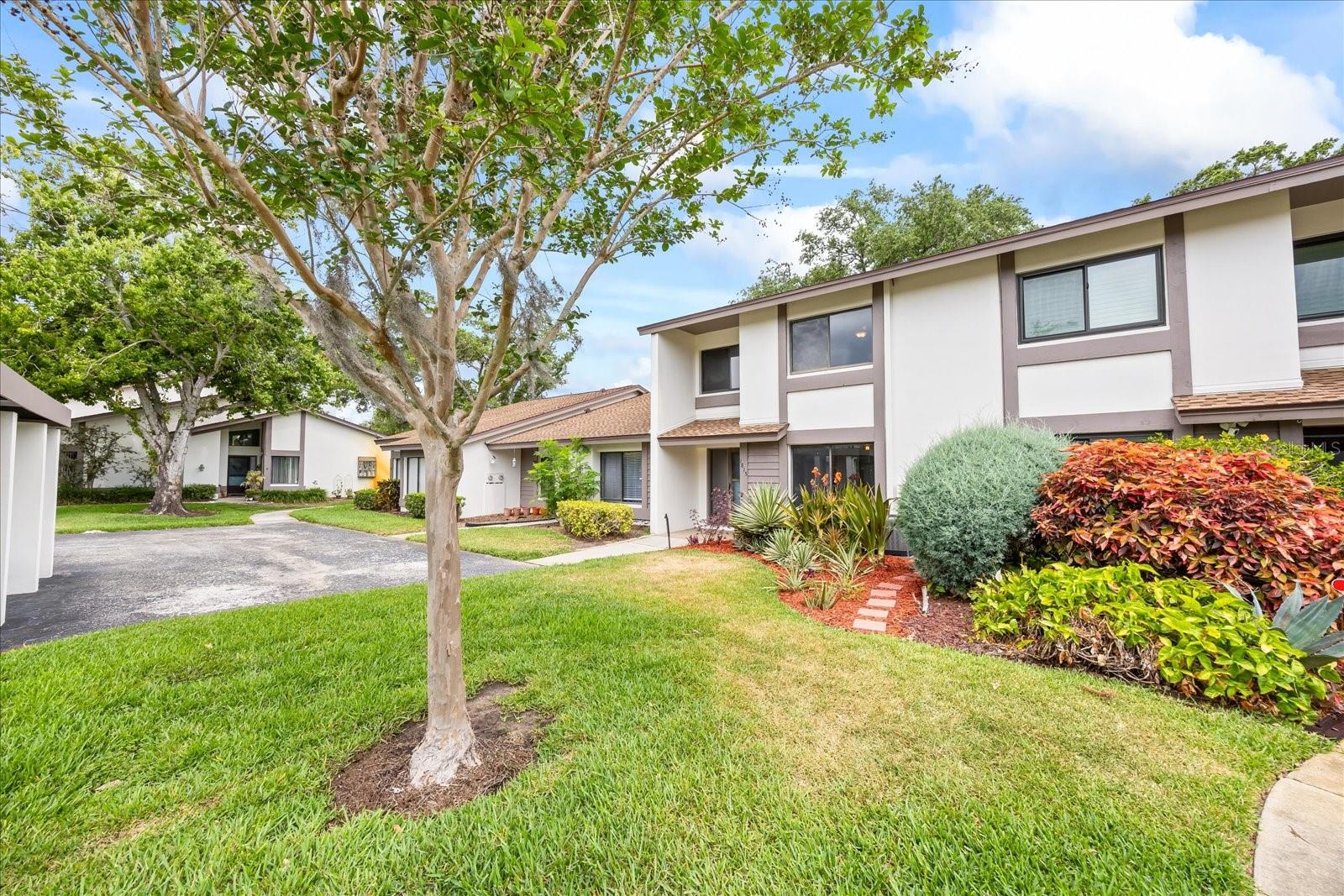 A perfect blend of coastal flair and modern conveniences, this updated 2br/2ba townhome is located in Safety Harbor’s desirable Cypress Trace community. Inside you will find a light-filled interior with a coastal inspired kitchen remodel featuring white shaker cabinetry, stainless steel appliances and granite countertops. The living room is bathed in light and feels extremely spacious with a soaring two story ceiling and tile flooring that flows throughout. The guest bedroom and bathroom are found on the first floor for convenience and ease. The spacious primary suite with updated bath (2024) is located on the second floor providing for ultimate privacy and peace. If you work from home or need the extra space, the loft offers a flexible area for a variety of different activities. No exterior maintenance for you to do here enabling you to relax and unwind whether by the community pool or in your own private screen enclosed lanai overlooking the lush tropical landscape. Invite your friends and family to come join you for a gathering because there is plenty of guest parking and one dedicated carport assigned to this unit. The HOA has recently replaced the roof (2019) and painted the exterior of this building (2024). Other thoughtful upgrades in this home include a whole house Halo water conditioning system (2021), new electric panel (2023), new AC (2017), new ductwork & air scrubber (2023). For additional peace of mind, this home has been pre-inspected and is insurance-ready! Fantastic location only minutes from downtown Safety Harbor’s restaurants, breweries, shops and parks. A fabulous opportunity for you to buy your own little piece of Safety Harbor!