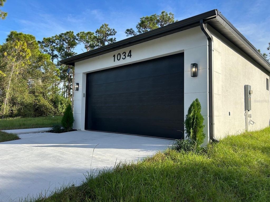 Photo of 1034 Alcalde Street E, Lehigh Acres, FL 33974 (MLS # O6402990)