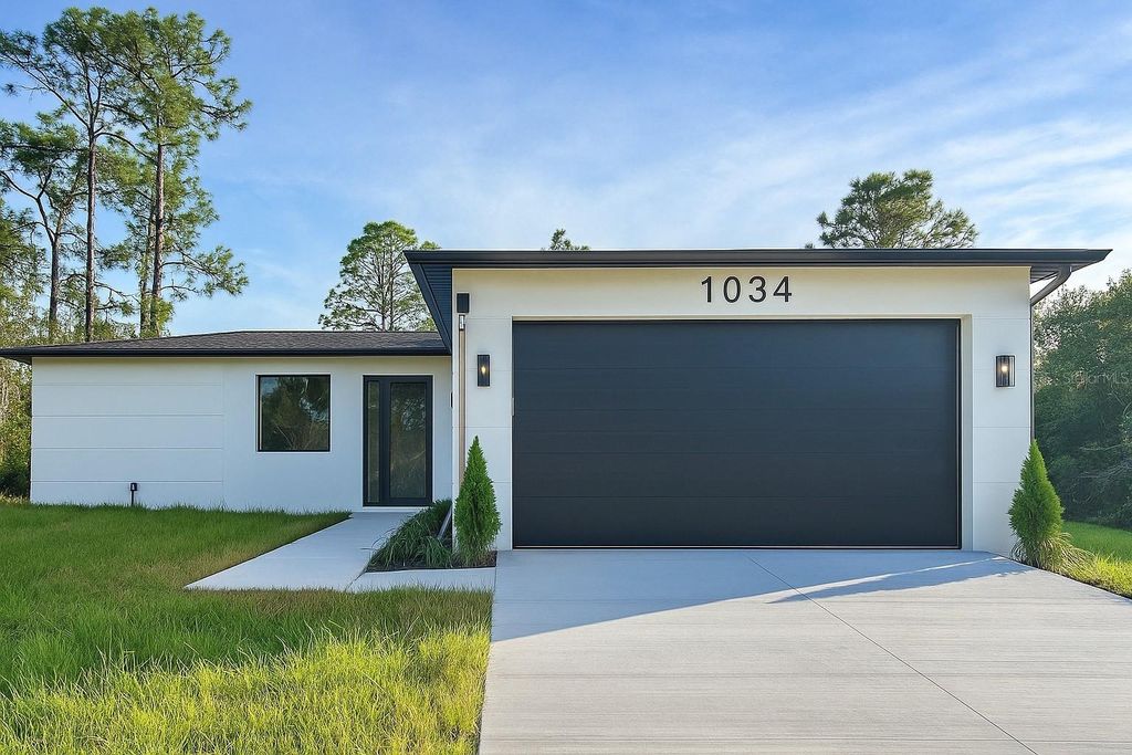 Photo of 1034 Alcalde Street E, Lehigh Acres, FL 33974 (MLS # O6402990)