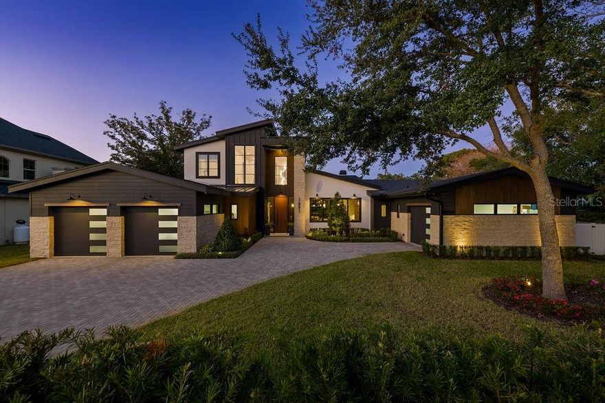 Welcome home to this one-of-a-kind custom-designed and built home by Ferrarini Custom Homes, Inc. in February 2024. This singular mid-century modern home is like no other in Winter Park.  Boasting an ideal location just steps from Phelps Park as well as only 1.5 miles from Park Avenue makes it the ideal home for the most discerning buyer.  Custom features abound in this stunning 4582 sq. ft. masterpiece, including white oak floors, beams, and wood details in most rooms, 5 BRs, and 4.5 BAs.  The first floor features a primary suite and guest suite as well as an office, great room, dedicated bar, dining area, and exquisite kitchen with a secret pass-through door to the scullery.  The second level boasts three generously sized bedrooms and two baths.  Cable wire railing, stone, wood inlay details, custom front door, oversized lanai with summer kitchen, outdoor fireplace, huge pool with firepit and separate firepit conversation area, the list goes on and on...   This unique lot is a rare find in Winter Park - oversized in both width and depth with dimensions of 155’ deep and 143’ wide.  The interior features over 6600 square feet under roof and a 4-car garage with a work-bench area included. 

The outdoor area features a 34-foot patio with a built-in gas grill, gas fireplace, and large-format porcelain pavers.  The remote screen provides you with ease of access to your custom-designed pool with pebbletec, an outdoor shower, and a firepit nestled amongst the landscaping.  The rear yard is completely irrigated and includes a well for irrigation to keep water expenses down significantly.  The custom-designed pool is large for Winter Park, featuring a lounging shelf as well as a 10’ fire feature and swim-out.  The massive deck is adorned with wood-like porcelain pavers with a porcelain coping.

Smart home features in this home include wireless controls for audio, a/c, garage doors, pool equipment, lighting, and exterior cameras. Additionally there is upgraded spray foam insulation, gas appliances (water heaters, fireplaces, washer, range), and an elevation featuring Cultured stone, Hardi Siding, and a Jeldwyn 10’ front entry door.  Herringbone pavers lead you from the cobblestone street to the magnificent front entry.  Buyers will enjoy the extensive landscaping and privacy hedges.  The landscaping is mature for a brand-new home!  Privacy abounds everywhere in this home.  Custom landscape lighting adds to the estate feel of this home.
 
The gourmet kitchen features all Wolf and Sub-zero appliances, which include a Wolf range, Wolf 2cd oven, steam oven, Sharp microwave, Cove dishwasher with custom wood panel, a Sub-zero Refrigerator with custom panel, and a Sub-zero Freezer also with a custom panel.  Disguised between the refrigerator and freezer is a secret hidden door to the scullery.  Exotic countertops abound throughout the house.  Quartzite like you have never seen before is evident in the kitchen and bar.  Antolini Italian marble that was specially treated with “Zerocare Plus” can be found on the kitchen counters and kitchen backsplash. Custom cabinetry throughout the house, featuring white oak.  Additional appliances include 3 beverage refrigerators, 1 wine refrigerator, ice maker, and a secondary 36” refrigerator.  Every detail has been thought-out and implemented for you in this breathtaking home! 

Do not wait - the work has been done for you with NO waiting time for new construction.  This elegant home will not last!