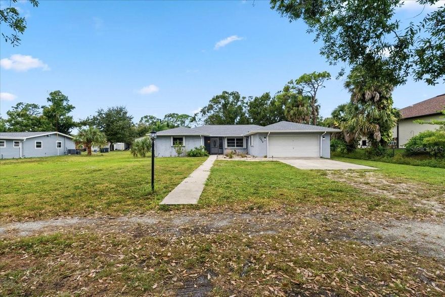 This one-of-a-kind property is in the PERFECT LOCATION in Venice! Golf cart to Manasota beach! This is a true 4 bedroom 2 bath home on almost .7 acre lot! There is a 2 car garage PLUS additional 2 car garage behind the home! NEW ROOF was installed in 2023. For peace of mind during storm season, this home is equipped with accordion style hurricane shutters for all windows & the garage has been reinforced. This home is NOT IN A FLOOD ZONE & has never flooded. There are NO CDD FEES and NO MANDATORY HOA FEES in this neighborhood & it is on public water & sewer! As you enter the home you will notice the new floors and fresh paint. The living room is straight ahead, dining room to the right, and entry to the kitchen beyond the dining room. The kitchen has newer appliances and the cabinets were replaced a few years ago. Beyond the kitchen is the dinette and family room with lots of windows—providing tons of natural light. The family room even has a cozy wood-burning fireplace — ready to hang your Christmas stockings! Beyond the kitchen is entrance to the spacious primary bedroom with ensuite bath & walk-in closet. On the opposite side of the home are 3 true bedrooms and guest bathroom with shower/tub combo. This home is not in a deed restricted community so bring your RV, boat, and pets! Shamrock Park is nearby with pickleball, tennis, basketball, large playground, scenic nature trails, outdoor gathering pavilion, & entry to the Legacy Trail! Venice Island is also nearby and is known for its beaches, shopping, dining, splash pad, parks, playgrounds, fishing pier, tennis courts, weekly farmer’s market, tons of events, and so much more! Schedule your showing today and start living the Florida lifestyle! (See floorpan in photos.)