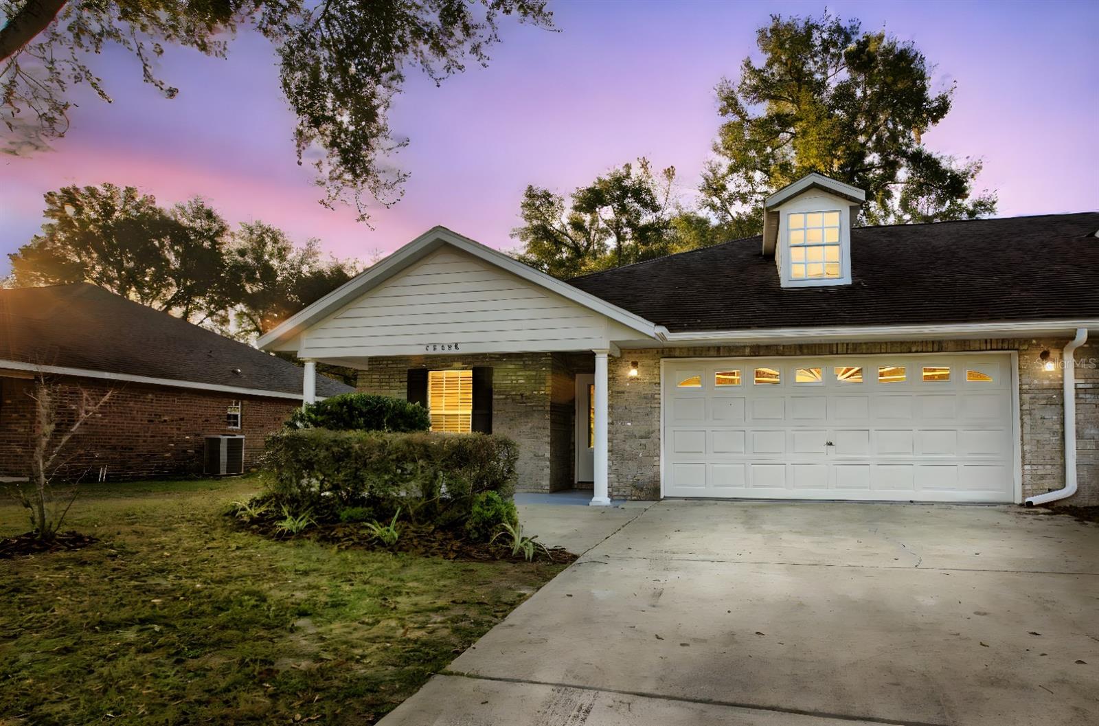 One or more photo(s) has been virtually staged. If Your Looking For Home Sweet Home, This Is It! Beautiful duplex in quiet neighborhood, and close to scenic and historic downtown Newberry! Walking distance to all 3 schools: grade, middle & high. Enjoy the convenience of small town life as well as the beauty of nearby natural springs. Scuba divers from around the world travel to High Springs just up the road to dive the beautiful springs. The indoor archery center only a mile away in the City of Newberry is Olympic quality rated! Brand new Publix Grocery is less than 2 miles, less than 1-2 miles to numerous fast and easy restaurants such as Cilantro Taco, Villagio Pizza, Country Kitchen, Los Avina Mexican, Hardee’s, Subway, and Dairy Queen. Downtown Newberry offers a unique array of family owned retail boutique shops, hardware stores, Dentists, and beauty salons. The neighboring small town of High Springs is only 15 minutes away. Quick and easy, straight shot drive east on Newberry road commute to Gainesville with UF and Sante Fe colleges. North Florida Regional Medical Center Hospital and the Gainesville Oaks Mall is only 13 miles away. Get the best of all worlds with this beautiful duplex! Owners are Licensed Realtors.