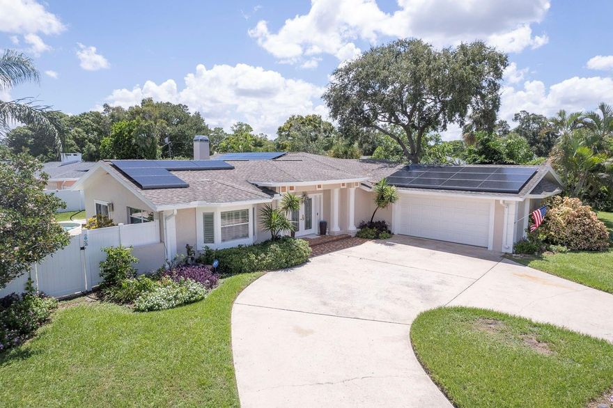 METICULOUSLY MAINTAINED AND BEAUTIFULLY RENOVATED! Discover the pinnacle of turnkey luxury in the gorgeous Harbor Bluffs residence. This exceptional pool home has been comprehensively reborn, boasting an astounding $250,000+ in professional updates, presenting an essentially brand-new property in the highly coveted Harbor Bluffs community. Every detail has been carefully considered, from the seamless open flow and intelligent split floor plan to the refined finishes throughout. The heart of the home, a chef’s dream kitchen, showcases brand-new custom wood cabinetry, expansive quartz countertops, soft-close drawers with integrated pullouts, and a complete suite of brand-new, matching premium appliances. Retreat to the luxurious Owner’s Suite, complete with a spacious walk-in closet and a redesigned, opulent en-suite bath featuring a new garden tub and elegant shower. The property's allure extends outdoors to an oversized corner lot, transformed into a private resort with lush, mature landscaping and a spectacular pool area – an entertainer's delight. French doors from both the Owner's Suite and the family room provide gracious access to this serene outdoor haven. Beyond aesthetics, significant infrastructure upgrades include new LVP flooring throughout, new vanities and quartz countertops in all three bathrooms, a new 5-ton HVAC system, a new water heater, and new solid wood interior doors. Embrace remarkable energy efficiency and minimal electric bills thanks to the 2022 solar panel installation, complemented by a new solar-powered EV charger in the garage. Conveniently located just minutes from the award-winning Clearwater Beach, this magnificent home offers an unparalleled opportunity to simply unpack and begin enjoying the ultimate Florida lifestyle.
