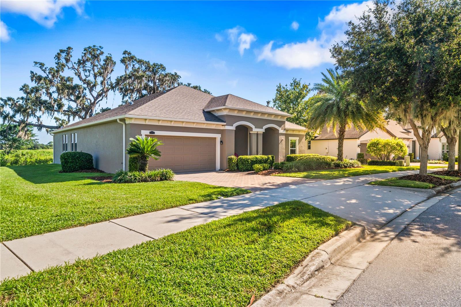 Your Private Retreat in Winter Garden’s Gated Hickory Hammock!
Imagine waking up to wide-open conservation views—two lakes and a pond stretching out with no rear neighbors, just peaceful Florida beauty and quiet wildlife passing by. This home sits on nearly half an acre with a premium 100-foot conservation lot, shaded by live oak trees, and extra space from a 20-foot easement for added privacy.
Step inside and discover over 2,8400 square feet of living space designed for both comfort and connection. With 5 bedrooms and 3.5 bathrooms, there’s room for everyone. The chef’s kitchen—with its oversized island, stainless steel appliances, and double ovens—becomes the heart of every gathering, making meals and memories effortless. The screened-in porch is your invitation to slow down: start your mornings with coffee, and end your evenings with your favorite drink and unforgettable sunsets.
Every detail adds to the ease of living here. A large driveway welcomes guests, and thoughtful extras—like a 65-inch Samsung Frame TV, outdoor garage refrigerator, and washer/dryer—are already included with your new home. This pet-free, one-owner home has been lovingly maintained and is move-in ready.
Your lifestyle extends beyond your front door. Hickory Hammock is more than a gated community—it’s a resort-style experience. Swim in the gradual-entry pool, play tennis, pickleball, or volleyball, stay fit in the gym, or connect with neighbors at the dog park and clubhouse. Golf-cart-friendly streets make it easy to enjoy it all.
And when you’re ready to venture out, you couldn’t ask for a better location. Just minutes from charming downtown Winter Garden, you’ll enjoy restaurants, shops, 22 miles of biking trails, and Orlando’s best Saturday Farmers Market. Winter Garden Village, Advent Health, and top-rated schools are all nearby. Disney is 20 minutes away, Universal and downtown Orlando are 25, and Orlando International Airport is just 30 minutes.
This is more than a house—it’s a lifestyle. A private retreat where convenience meets peace, and every day feels a little like vacation.