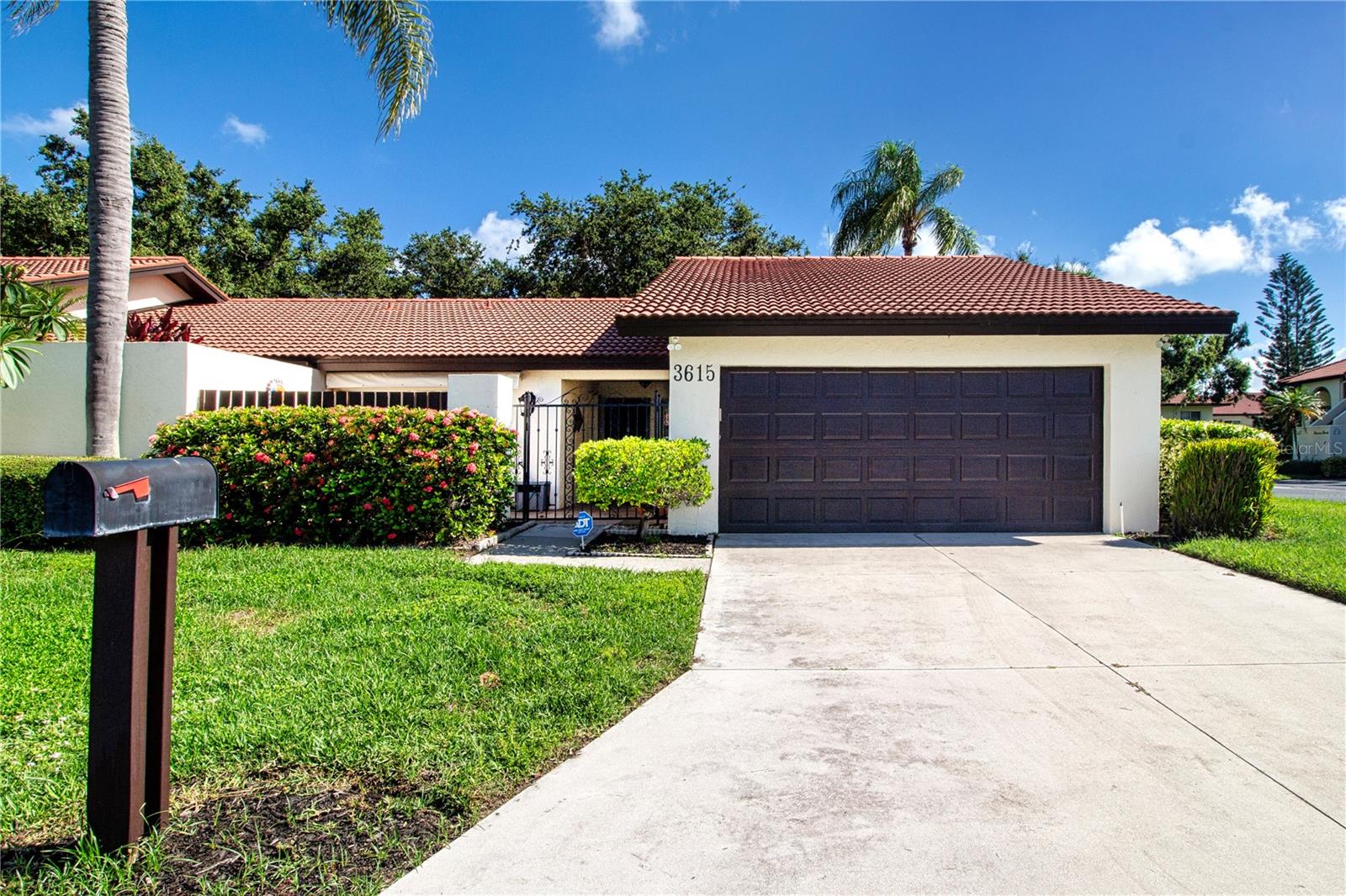 Near the beach! Storm ready! 55+, turnkey Sarasota furnished villa. Just listed. Whether you're after a winter home, investment or are moving to Florida full time this comfortable villa is a must see. You'll fall in love with the split 2/2 floor plan, spacious living rooms vaulted ceilings and the 4 season Florida room that opens to the screened lanai. The kitchen is light and bright, full of storage options and leads to a versatile bonus room that can be a den, office or breakfast area. The front patio is nicely paved (and covered with a sun shade) with plenty of room for lounging or cocktails. The full 2 car garage is nicely outfitted with storage, a small work area and a nice clean epoxied floor. Village Plaza is an active and friendly 55+ community, beautifully maintained and located just 15 minutes from Siesta Key or Downtown Sarasota. Shopping, medical, dining, banking. golf and so much more is just around the corner. 3 miles to I 75 and 25 minutes to SRQ airport. Don't miss this one!