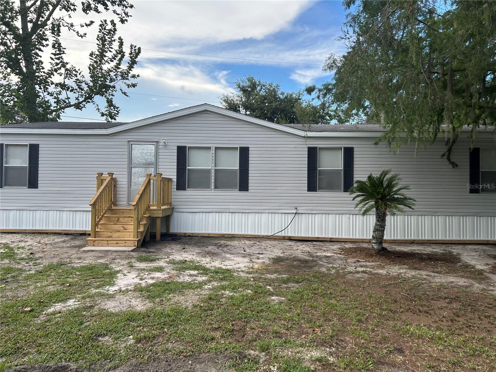 Come see this Spacious 3-Bed, 2-Bath Double Wide Mobile Home in DeLand! This charming, slightly older double wide mobile home offers plenty of space and potential! Featuring 3 bedrooms, 2 bathrooms, including a luxurious bathroom with a jacuzzi tub and double sinks, this home provides comfort and convenience for the whole family. The open layout and generous yard give you room to relax, entertain, or create your own outdoor oasis. With a little cosmetic updating, you can make this home truly your own. Great location in DeLand with local amenities being close by. This property is a fantastic opportunity to invest in a comfortable and spacious home. Don’t miss your chance to make it yours!