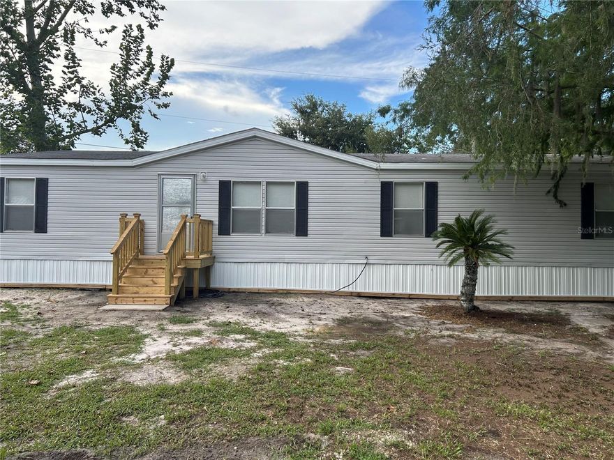 Come see this Spacious 3-Bed, 2-Bath Double Wide Mobile Home in DeLand! This charming, slightly older double wide mobile home offers plenty of space and potential! Featuring 3 bedrooms, 2 bathrooms, including a luxurious bathroom with a jacuzzi tub and double sinks, this home provides comfort and convenience for the whole family. The open layout and generous yard give you room to relax, entertain, or create your own outdoor oasis. With a little cosmetic updating, you can make this home truly your own. Great location in DeLand with local amenities being close by. This property is a fantastic opportunity to invest in a comfortable and spacious home. Don’t miss your chance to make it yours!