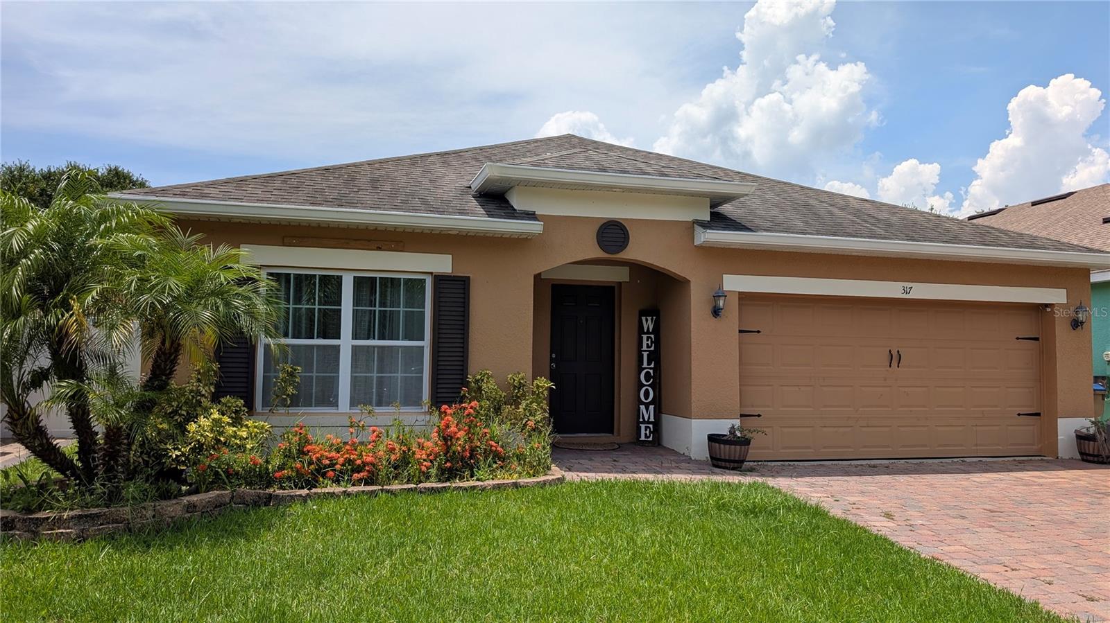 This beautiful, 4-bedroom, 2-bathroom home is situated centrally in the heart of Kissimmee. Located in the gated Magic Landings community just off the Turnpike, it offers easy access to central Florida's main attractions. The property can be used as a primary residence or an investment home. With four good-sized bedrooms, an open-plan living area, this home is perfect for living or vacationing. The position of the home is one of the best in the community, with no rear neighbors and a private rear yard with side fence. The open concept dining, living room, and kitchen fit today's modern style of living. The front two bedrooms provide nice separation of bedrooms for added comfort. There is space to park two cars in the oversized garage.