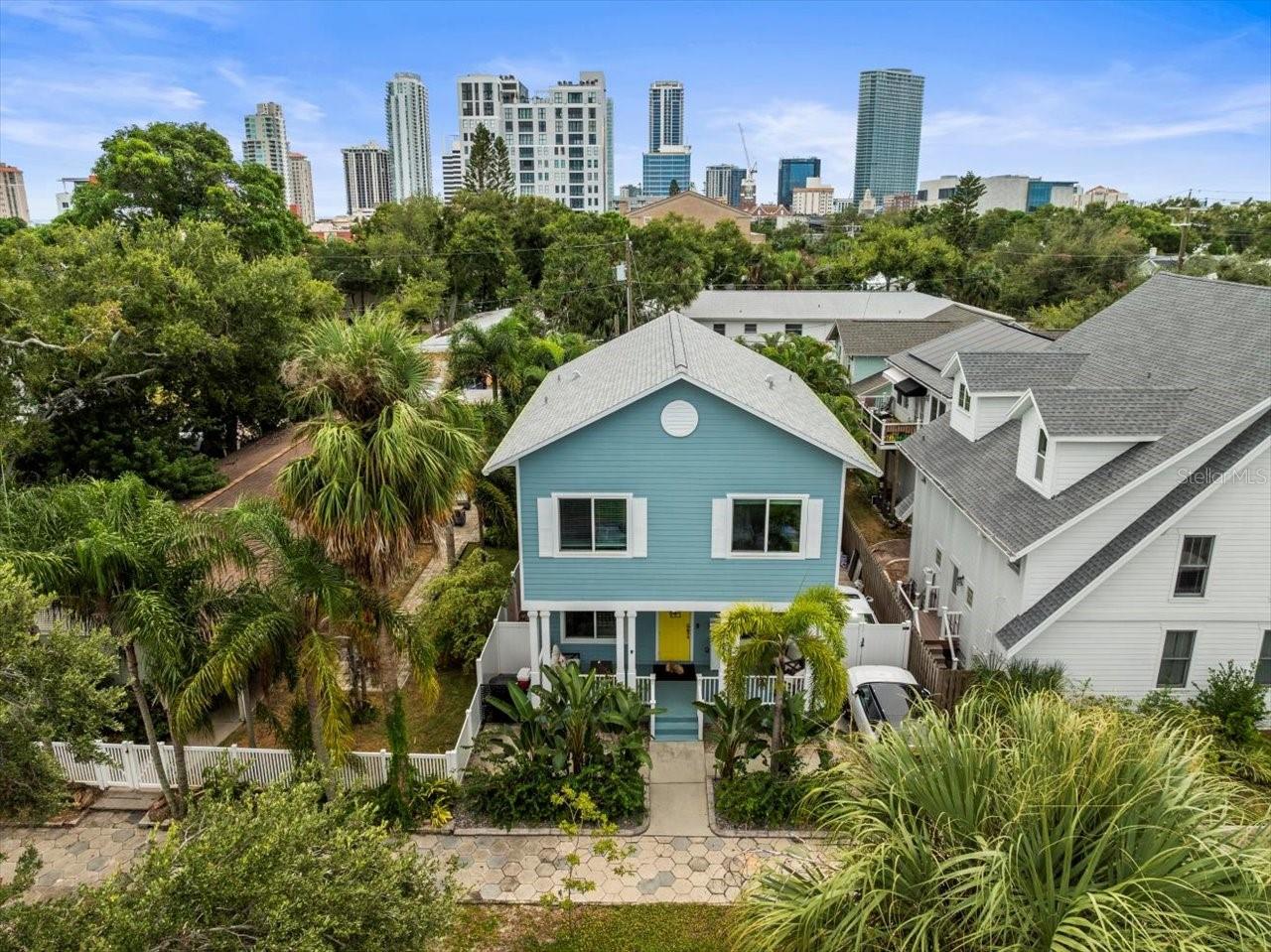 Beautiful Two-Story Home in Historic Old Northeast area is now available and NOT in a flood or evacuation zone!!
Just steps from 4th street, the waterfront and dog park, with vibrant downtown St. Pete in your backyard, this 1,782 sq ft home lives much larger thanks to soaring 10-foot ceilings on both levels.
A welcoming front porch sets the tone—perfect for your morning coffee and enjoying Florida’s breezes. Inside, the open-concept layout highlights an elegant electric fireplace as the centerpiece of the living area. The dining space flows seamlessly into the kitchen, which features solid wood cabinets, Bosch appliances including a gas stove, a breakfast bar, and a closet pantry. Sliding doors off the dining area lead to a private backyard with a covered porch, paved patio, low-maintenance turf, and a storage shed. The fully fenced yard also includes a side gate with the potential for extended driveway parking—ideal for an RV or water toys.
Upstairs, the primary suite offers a spacious walk-in closet, an ensuite bath with granite countertops, a walk-in shower, and a separate soaking tub. Step outside through sliding doors to your private balcony overlooking the backyard—an inviting retreat for coffee or wine. Two additional guest bedrooms and a convenient laundry closet complete the upper level.
Built in 2006, this home has been thoughtfully updated with a roof, custom closets, hardwood staircase, modern lighting, fencing, and turf (all circa 2020). Additional features include hurricane-rated windows and sliding doors, a tankless water heater, a 50-amp circuit with wall-mounted Level 2 car charger (2022), and a newer custom fireplace wall and surround.
This prime location can’t be beat—close to downtown St. Pete, the Vinoy Resort & Golf Club, the Pier, museums, fine dining, and vibrant nightlife. 20 minutes to Tampa international airport, Tampa international Port, and a short drive to our consistently top 10 white sand Beaches including Clearwater, St Pete Beach and the famous Fort Desoto. Don't forget our winning Pro teams!! Tampa Bay Lightning, The Rays and The Buccaneers are all within reach and so much fun to see live. Pinellas County really has it all!