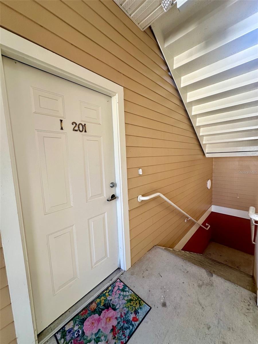 Live in the heart of Haile Village Center! This beautifully updated condo features wood-style tile floors, crown molding, high ceilings, and a private balcony overlooking charming brick-lined streets. The kitchen offers stainless steel appliances, solid surface countertops, and plenty of storage. Enjoy walkable access to dining, boutique shopping, and community events. Just minutes from UF, Shands, and local shopping. All furniture and appliances in listing photos to be included-partially furnished.