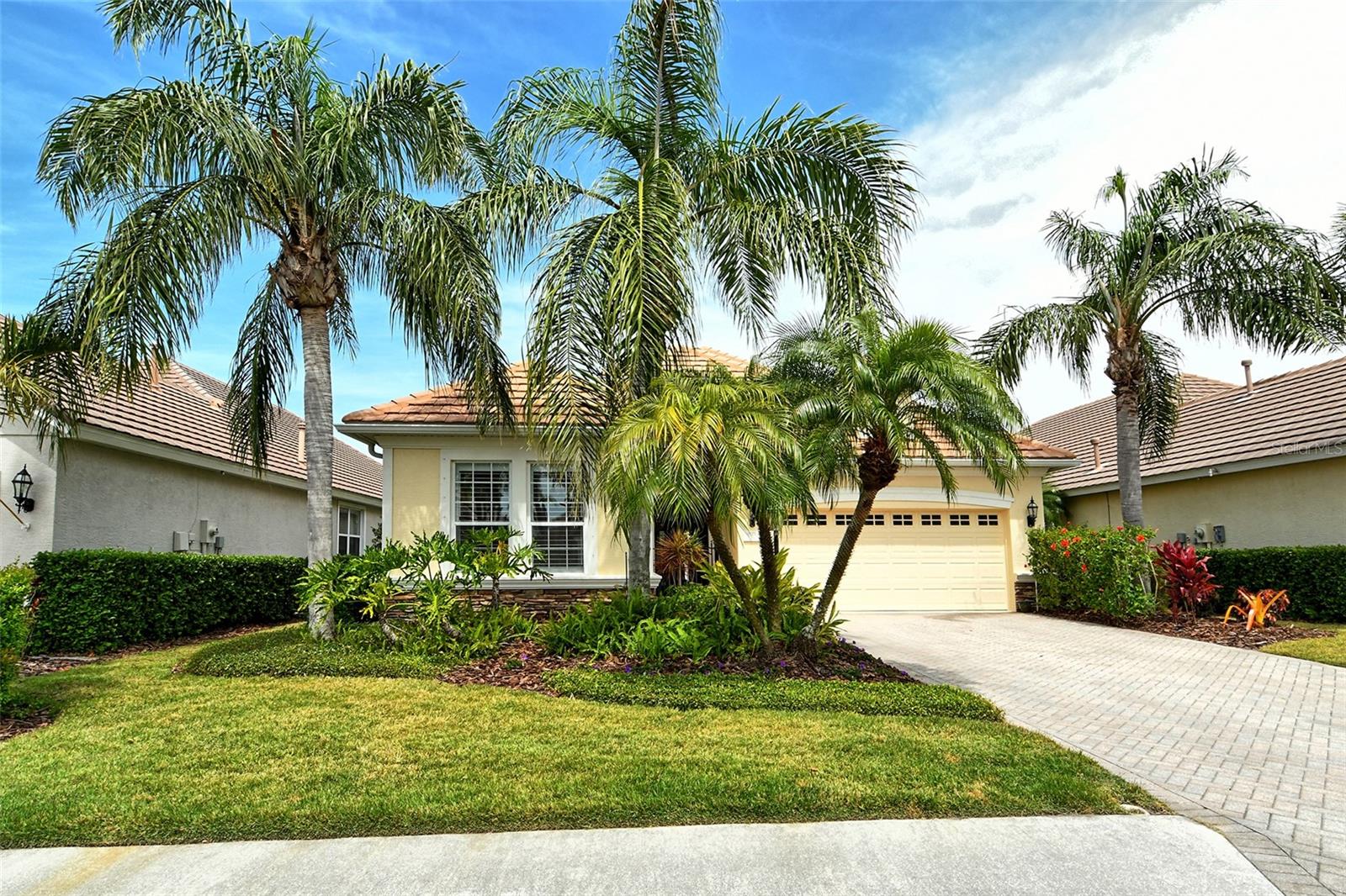Discover effortless Florida living in this beautifully maintained maintenance-free home located in the sought-after Country Club of Lakewood Ranch. Enjoy serene water views from your expanded lanai, perfect for relaxing or entertaining.
This charming 2-bedroom + den/office home showcases a desirable great room floor plan with light neutral tones, tile flooring throughout the living areas, and engineered wood in the bedrooms. The chef’s kitchen boasts staggered cabinetry, silestone countertops, and a cozy breakfast nook with sliding doors that bathe the space in natural light. A separate formal dining room adds an elegant touch, while the spacious living area features two sets of sliders leading to the lanai for seamless indoor-outdoor living.
Retreat to the primary suite, a private oasis with two custom walk-in closets, tray ceiling, and a relaxing sitting area. The spa-like primary bath includes dual vanities, a garden tub, and a walk-in shower.
Recent updates include fresh interior paint, stylish upgraded light fixtures and fans, modern cabinetry hardware, plantation shutters and shades, hurricane shutters on front and side windows, electric hurricane shutter on front door, and enhanced landscaping. The Orchid Island neighborhood offers lawn care, a community pool, and low-maintenance fees for stress-free living.
Lakewood Ranch is a premier master-planned community featuring a private Country Club, four championship golf courses, 18 lighted tennis courts, a top-tier athletic center, a polo club, scenic parks, and walking trails. Plus, you're just minutes from Waterside Place, Lakewood Ranch Main Street, University Town Center, and world-class Gulf Coast beaches.
Experience the best of Florida living—schedule your private showing today!