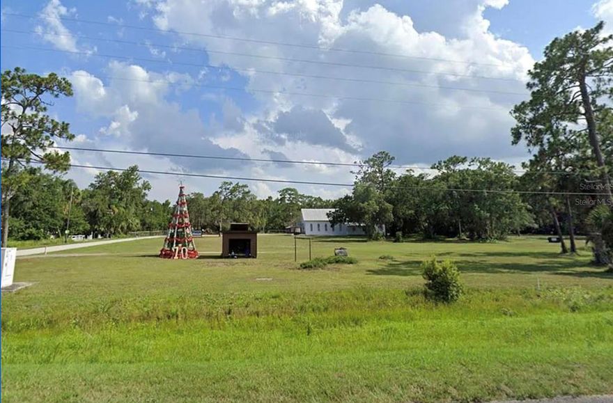 Build Your Legacy on Iconic E Colonial Drive! This 0.17-acre commercially zoned parcel sits directly infront of the beloved Christmas tree and
mailbox in Christmas, Florida—an iconic roadside attraction that draws thousands of visitors year-round to send holiday letters stamped from
“Christmas.” With over 10,000 vehicles passing daily along E Colonial (Route 50), the visibility is exceptional. Perfect for a commemorative
plaque bearing your family’s name, creating a legacy that lasts. Imagine a butterfly garden with benches, food truck setups, commercial signage, or a unique roadside stop—this flexible-use land offers the opportunity to blend community impact with smart investment. (NO MOBILE HOMES! NOT RESIDENTIAL!!!)