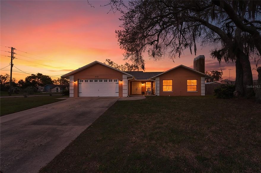 Welcome to your very own slice of Florida sunshine, where comfort, space, and possibility come together beautifully. Set on an impressive .40-acre just shy of a half an acre corner lot, this charming home features elegant double door entry, a cozy wood-burning fireplace, and the breathing room you have been looking for with just the right touch of privacy and openness. From the moment you arrive, you will appreciate the expansive setting, the convenience of a two-car attached garage, and the peaceful feel of having no neighbors directly in front and only one on the side. 1727 Sq ft living space

Step outside and discover a generously sized backyard with a spacious patio that is perfect for weekend gatherings, morning coffee, or simply unwinding in your own private retreat. With solid block construction, a classic shingle roof, and no HOA restrictions, this property offers both durability and the freedom to create the lifestyle you want, whether that means adding a pool, designing a garden, or building your dream outdoor space.