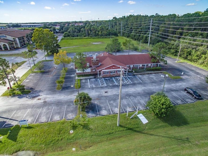 Development Property and Prime location of 4.53 acres S side of US Hwy 192. New Monument Sign and some impact fees included. Front parcel has an existing 5,777 SF commercial building with 95 parking spaces. Can be used for hotels, commercial, multi-family, retail. Existing storm water management pond located on back parcel. Zoning is Highway Commercial with a MU-V (Mixed Use-Vine). Future Land use is FLU designation. 60,000 traffic count. Future land use - mixed used, urban scale neighborhoods and villages eventually connected to major focal points and downtown Kissimmee. Possible storage unit facility. Within the Vine Street Corridor, this strategy promotes walking, biking, and reliance on various forms of transit.