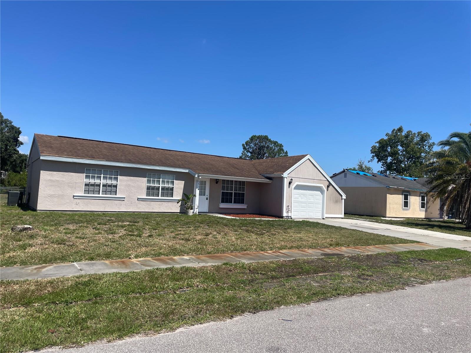 Right in the heart of North Port, this home is located in a deed restricted community. Central to everything, the convenience of location cannot be understated. The interior of the home has undergone a mini facelift and now the perfect palette for your family. The warm paint choice on the interior keeps the home feeling light and will complement any decor. Only tile flooring here! We Floridians know the appeal, not only for aesthetics and maintenance, but it helps keep the home cool. For those who enjoy cooking the open space in the kitchen is certain to please. Plenty of storage and counter space as well. Unwrap the formal dining room table again, as it will fit well in the dedicated dining area. Thanksgiving at your place! The master is spacious and can accommodate King sized bedding. Attached bathroom with step down shower and new vanity. The guest bathroom also has been upgraded with a new vanity and provides a tub/shower combo. After a hard day of play in the fenced back yard, your little ones can cool down and clean up in the bathtub. Behind the French doors off the dining area is a bonus room. Well suited for an office, playroom, workout space, or a den. Direct access to both the garage and the backyard. North Port is growing in leaps and bounds and is a great community to raise your family. You certainly will not be at a loss for things to do. The community pool is open and ready for swimming!!!