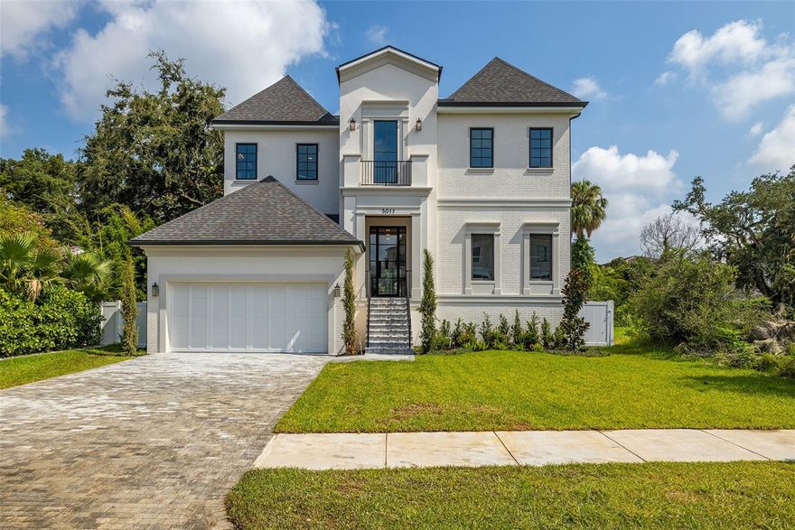 Welcome to your dream home in the heart of South Tampa! This stunning two-story new construction offers luxurious living with modern elegance and thoughtful design throughout. Boasting 5 spacious bedrooms, 5 full bathrooms, and 1 half baths, this home is perfect for families and entertaining.

Step inside through the grand foyer, where you'll be greeted by an open and airy floor plan. The first floor features a versatile guest suite, a convenient mudroom, and a tech room, perfect for working from home. The expansive great room seamlessly connects to the gourmet kitchen, which includes a large pantry, state-of-the-art appliances, and plenty of counter space for culinary adventures.

Step outside to your private oasis?an expansive covered lanai overlooks a sparkling pool and outdoor kitchen, ideal for year-round outdoor living and entertaining.

Upstairs, the master suite is a true retreat, featuring two generous walk-in closets and a luxurious ensuite bath with all the amenities you could desire. Three additional bedrooms, each with their own walk-in closets and ensuite baths, provide comfort and privacy for family and guests. A spacious loft and a convenient laundry room complete the second floor.

The home also includes a 2-car garage, providing ample storage and convenience. Located in the highly sought-after South Tampa area, this home offers proximity to top-rated schools, shopping, dining, and the beautiful Tampa Bay.