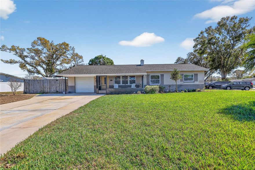 Exquisitely updated 3-bedroom, 1-bath home located in the highly established and desirable Holiday Park neighborhood! This move-in-ready residence showcases numerous upgrades throughout, including newer laminate flooring, stainless steel appliances, granite countertops, stylish backsplash, a newer 2018 Roof, 2024 A/C system, hurricane impact windows and an updated electrical panel.
Additional features include crown molding, newer baseboards and updated interior doors that enhance both comfort and style. The full one-car garage offers built-in shelving for convenient storage along with a washer and dryer hookup plus extra parking pad. 
Situated on a beautiful, oversized corner lot, this home offers both curb appeal and extra outdoor space...with a plus of NO HOA Fees.  Enjoy an unbeatable location just minutes from Tyrone Mall, popular shopping and dining, 5 miles from stunning Treasure Island Beach, I-275, and the vibrant downtown St. Petersburg nightlife. Also within walking distance to JW Cat Recreation Ctr. to enjoy the pool, tennis cts., baseball parks, pickle ball and loads of classes. Holiday Park is a vibrant, highly active community offering wellness walks, festive holiday golf cart parades, and a wide variety of fun, family-friendly activities throughout the year.
Everything you need is right at your fingertips — simply move in and start enjoying the Florida lifestyle today!