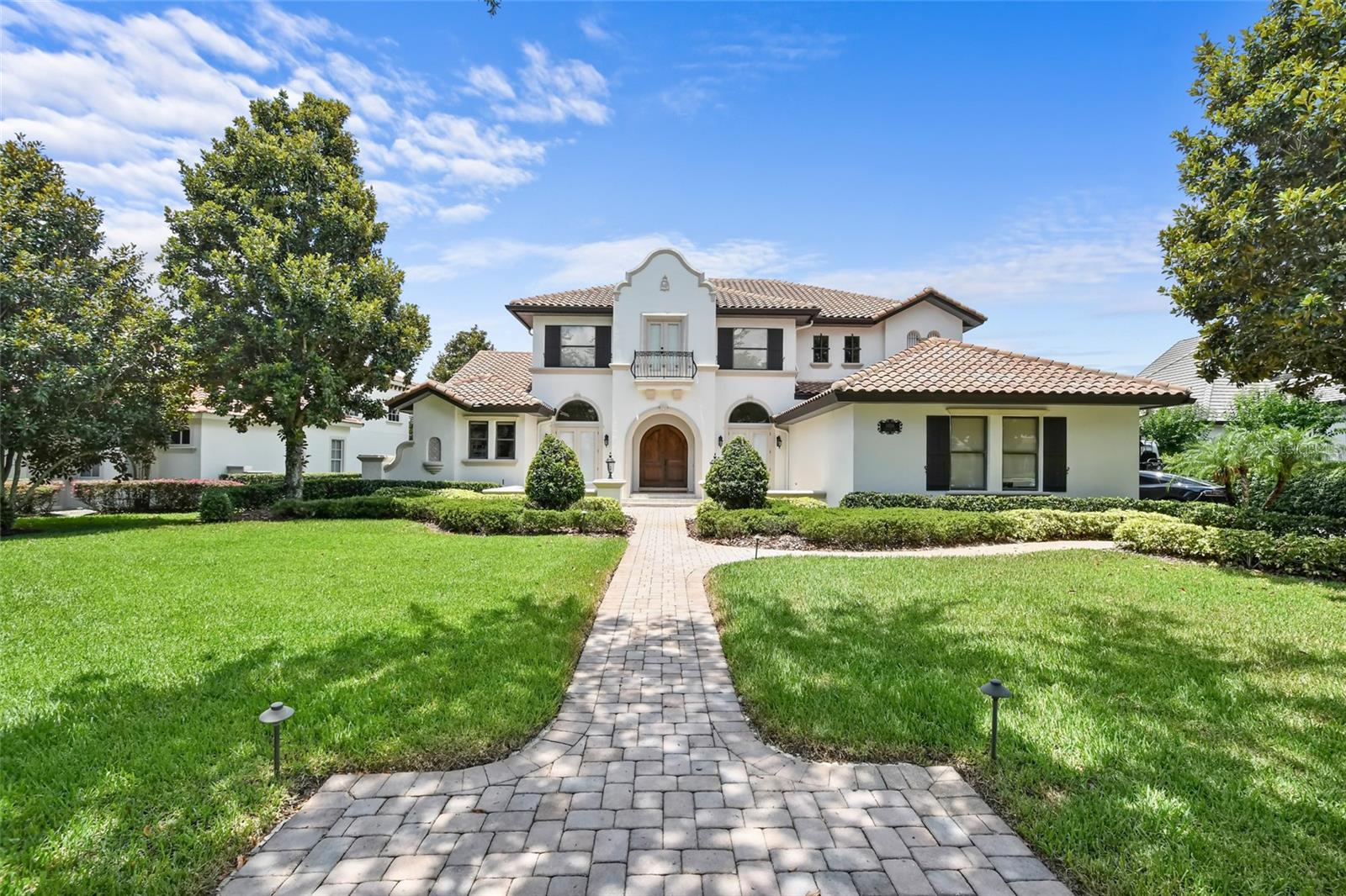 Welcome to 6856 Valhalla Way, located in the charming Windermere, Florida. This remarkable home offers a luxurious and comfortable living experience, boasting a range of exceptional features and stunning design elements. Nestled on a scenic property, this residence provides a picturesque view of the 14th hole from its beautiful pool area. Whether you're relaxing by the pool or entertaining guests, you'll appreciate the serene ambiance and the perfect blend of nature and elegance. Step inside, and you'll be greeted by a meticulously renovated and professionally decorated interior. Every detail has been carefully considered to create a harmonious and stylish living space. The home comes fully furnished, allowing you to immediately immerse yourself in its sophisticated atmosphere. The kitchen is a true culinary haven, equipped with brand-new Thermidor appliances that cater to the needs of even the most discerning chef. Prepare gourmet meals with ease while enjoying the sleek and modern design of the space. One of the standout features of this home is the expansive bonus room. Flooded with natural light streaming through its large windows, this versatile space offers endless possibilities for entertainment, recreation, or relaxation. Its open and airy layout provides a sense of freedom and comfort. For overnight guests, the four guest bedrooms offer a private retreat, each with its own ensuite bathroom. These well-appointed spaces ensure that everyone feels pampered and comfortable during their stay. Working from home has never been more enjoyable than in the dedicated office space with a private patio. This secluded area offers tranquility and the opportunity to immerse yourself in your work while enjoying the pleasant outdoor surroundings. The master bathroom is a masterpiece in itself, featuring elegant marble accents and a soothing atmosphere. Whether you're unwinding in the luxurious soaking tub or getting ready for the day in the spacious vanity area, this bathroom provides a serene and opulent experience. Throughout the entire home, you'll notice the impeccable taste in decor. Every corner reflects a commitment to quality and style, ensuring a cohesive and visually stunning aesthetic that is sure to impress your guests. This Windermere gem combines exceptional design, premium amenities, and a breathtaking location. Experience the epitome of luxury living in a home that has been meticulously crafted for your comfort and enjoyment.