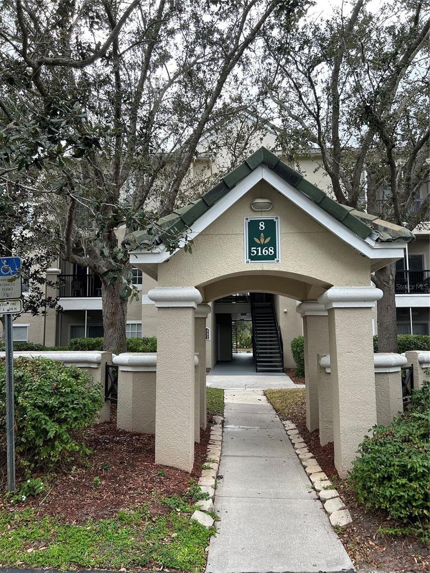 PRICE JUST REDUCED!!  Just Newly painted throughout, this two bedroom, two bathroom, ground level condo has new porcelain flooring in the kitchen, laundry room and both baths, a new range, a new LG dishwasher, new fans and a newly painted and epoxied detached garage with a new remote garage door opener. What else is new? Maybe you! Great place to rest and relax. The unit is set in the back of the building with tranquil pond views from the living/great room, primary bedroom and newly screened and freshly epoxied lanai. The unit has high 9 ft. ceilings with crown molding and includes an exterior newly epoxied storage closet by the front door. Just beyond the security gated entrance is a fabulous clubhouse with a fitness center, library, lounging area, kitchen, meeting rooms, an on-site manager's office and a lagoon-style community pool with a separate hot tub under a charming gazebo. A playground, a tennis court and grilling areas are also on the grounds and a second community pool exists further back in the complex. A Publix-anchored shopping center is just across from the entrance to the community and more shopping areas are right around the corner. Five minutes to I-75 and 15 minutes to Siesta Key, St. Armands Circle and downtown Sarasota. This one is a must-see! You will love it!!